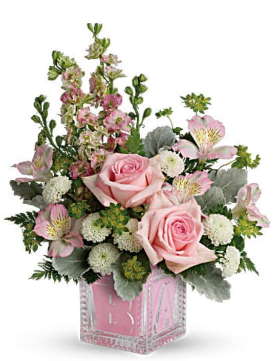 Baby Girl's First Block - Welcome the new addition with a charming glass baby block keepsake, bursting with a sweet pink and white bouquet of roses, mums, alstromeria, and stock.