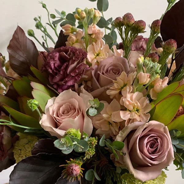 Designer's Choice - Soft &amp; Muted - Soft, muted tones make for a beautiful color palate any time of year.  PLEASE NOTE: Flower colors and varieties will vary due to availability. Our designers always select the freshest blooms for your arrangement.  Standard - 4" cylinder vase with a lush mix of seasonal blooms. Measures approximately 7"-8" tall and 7" wide.  Deluxe - 5" cylinder vase with a lush mix of seasonal blooms. Measures approximately 10" tall and 10" wide.  Premium - 6" cylinder vase with a lush mix of seasonal blooms. Measures approximately 12" tall and 12" wide 