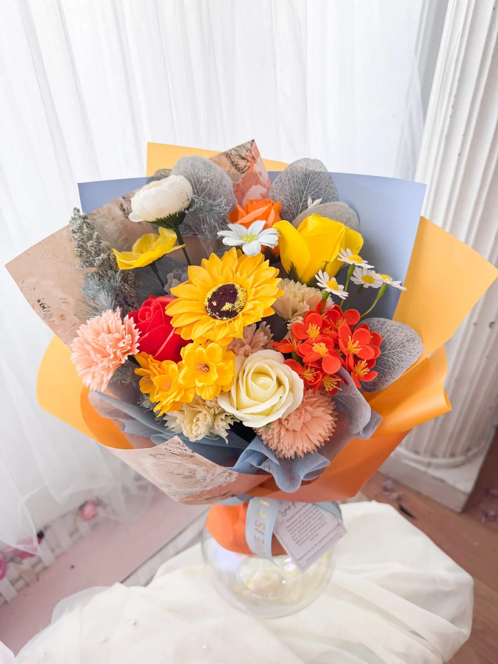 [SOAP FLOWER] Citrus Sky Soap Flower Bouquet - Soap flower bouquet in orange and sky blue, Korean-style wrapping, 3 sizes  A stylish and lasting bouquet made with vibrant soap flowers in a refreshing orange and sky blue palette, wrapped in elegant Korean-style paper for a clean, modern look. Thoughtful, photogenic, and perfect for any occasion.  