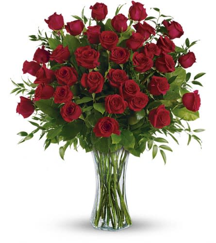 Breathtaking Beauty  - An extraordinary arrangement of three dozen premium red roses is artfully designed with lush greenery in a tall clear glass vase for a dramatic and unforgettable presentation. Grand, romantic, and undeniably elegant, Breath Taking Beauty is the ultimate expression of love and admiration—perfect for milestone anniversaries, proposals, grand celebrations, or when only the most impressive gesture will do.