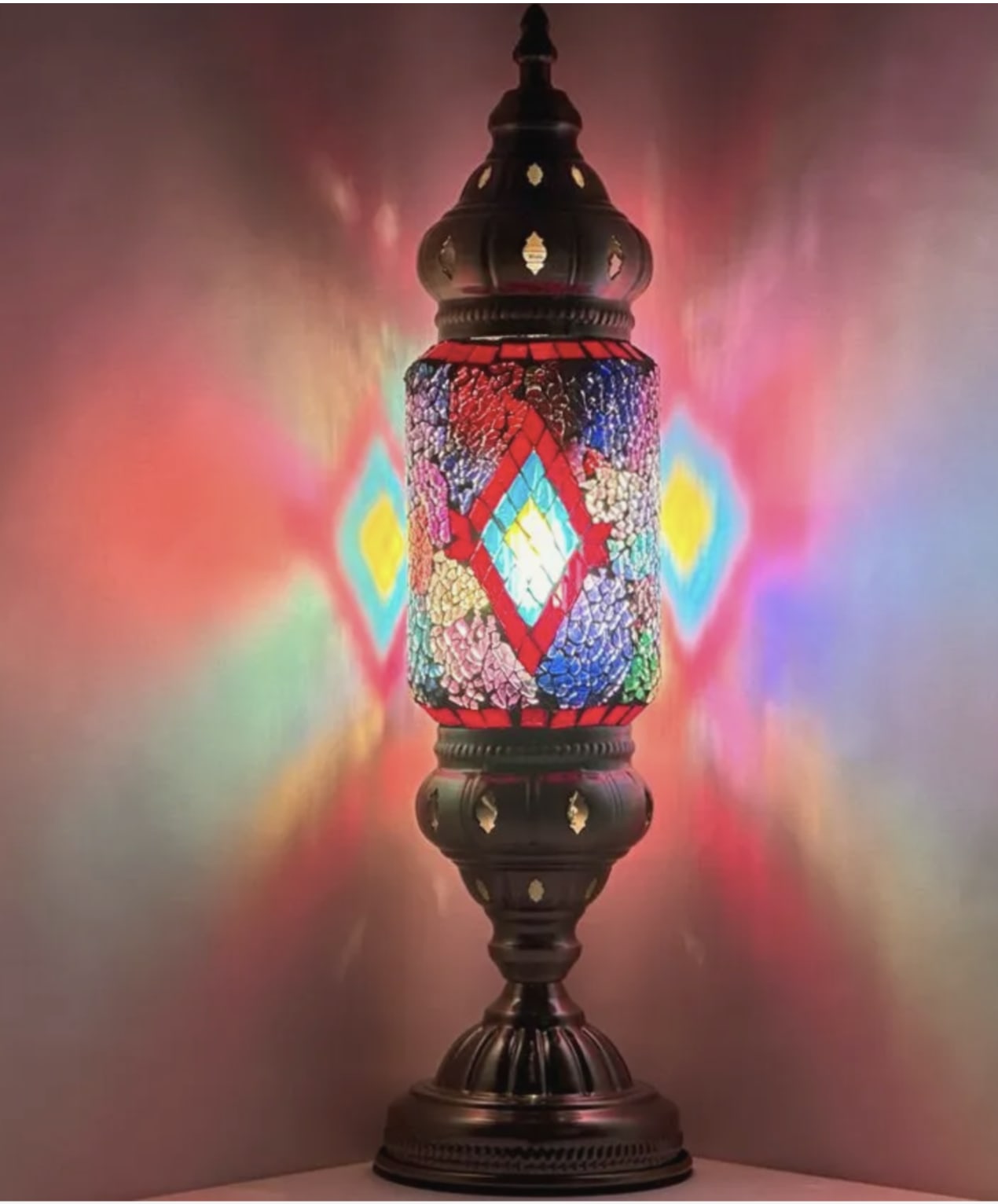 Cylinder Mosaic Lamp - These beautifully crafted lamps are made with colourful glass pieces in intricate designs that create a warm and inviting atmosphere in any room. Good for sympathy gifts or just a gift to brighten someone's room! Please note: Photos are for reference only. Actual designs and quotes may vary. If you are looking for a specific style we kindly ask that you give us a call to discuss availability and options.