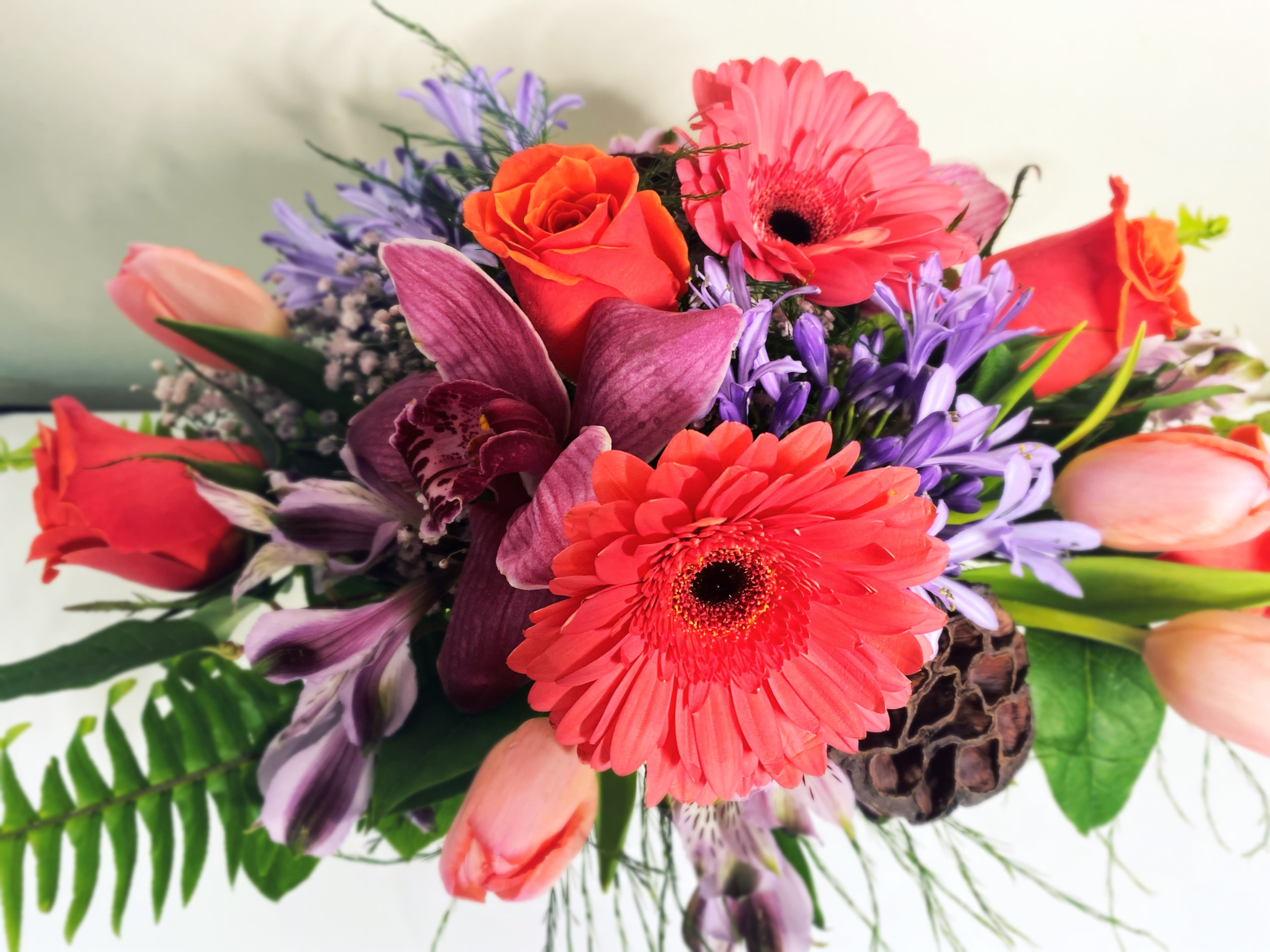 Lavender and Coral Pink Bowl - Simple and Elegant Lavender and pink Coral arrangement in silver mercury bowl. Approximately 10x14 x7 in