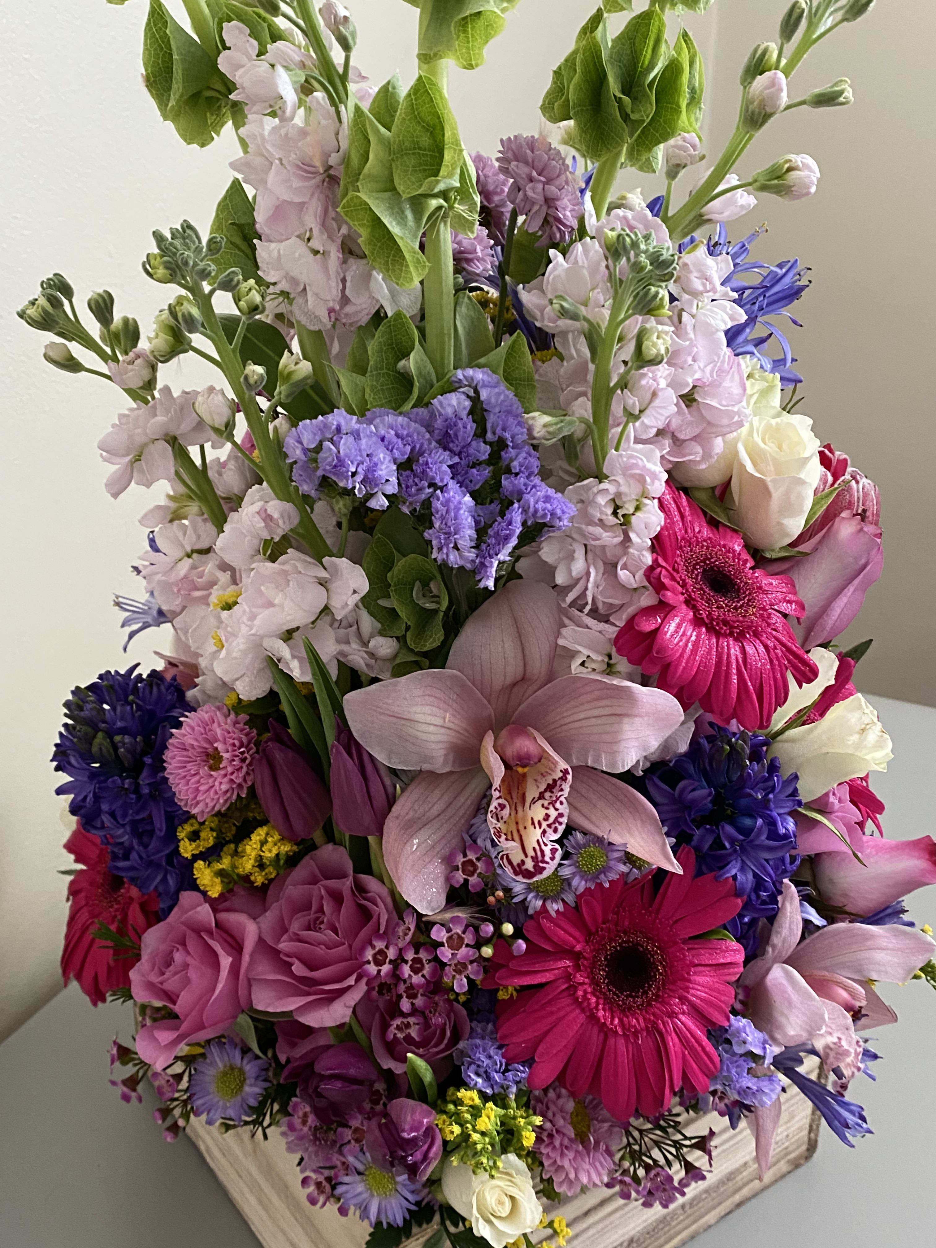 Spring Designers Choice - Let us design something special for you. We will use the freshest premium flowers of the day from the flower  market. When you order you can add tailored requests like colors, grand, traditional,modern, low and long, wide and tall. You can also email inspirational photos to us to attach to your order. We love designers choice because it gives us the freedom to give you the best value for your purchase and put our personal touch into your arrangement. Supply chain issues and inconsistencies in availability at the market are still a problem,we find this option will promise a lush and fresh floral gift that will awe you and your special person. 