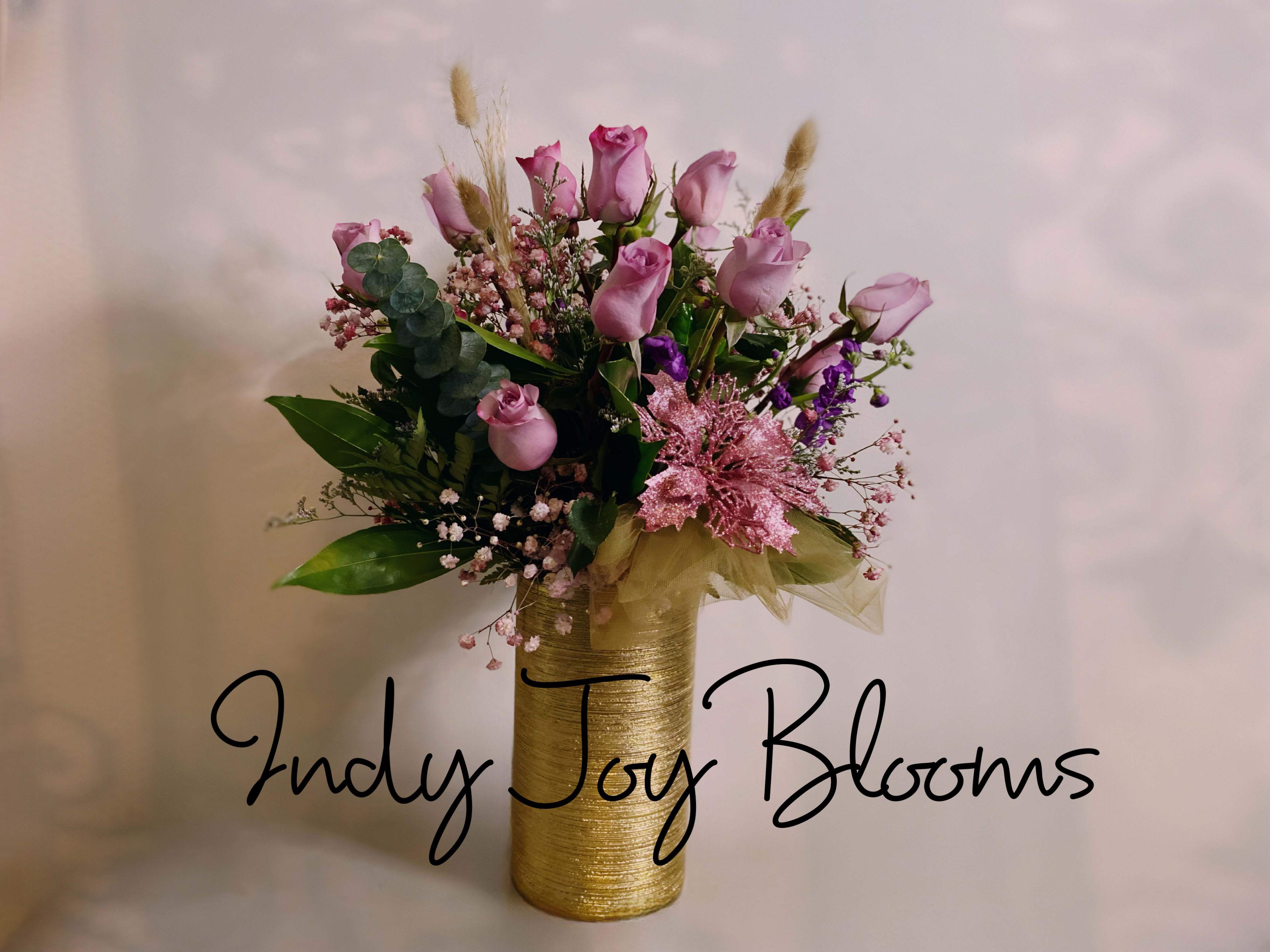 My violetta - Gorgeous lavender hue of 15 roses paired with lavender blooms lavender babies breathe in a tall bright gold keepsake ceramic vase. Take their breath away and send this to your special someone.   Like this design but in a different color? You can put in special instructions color you prefer and we can make it happen. 