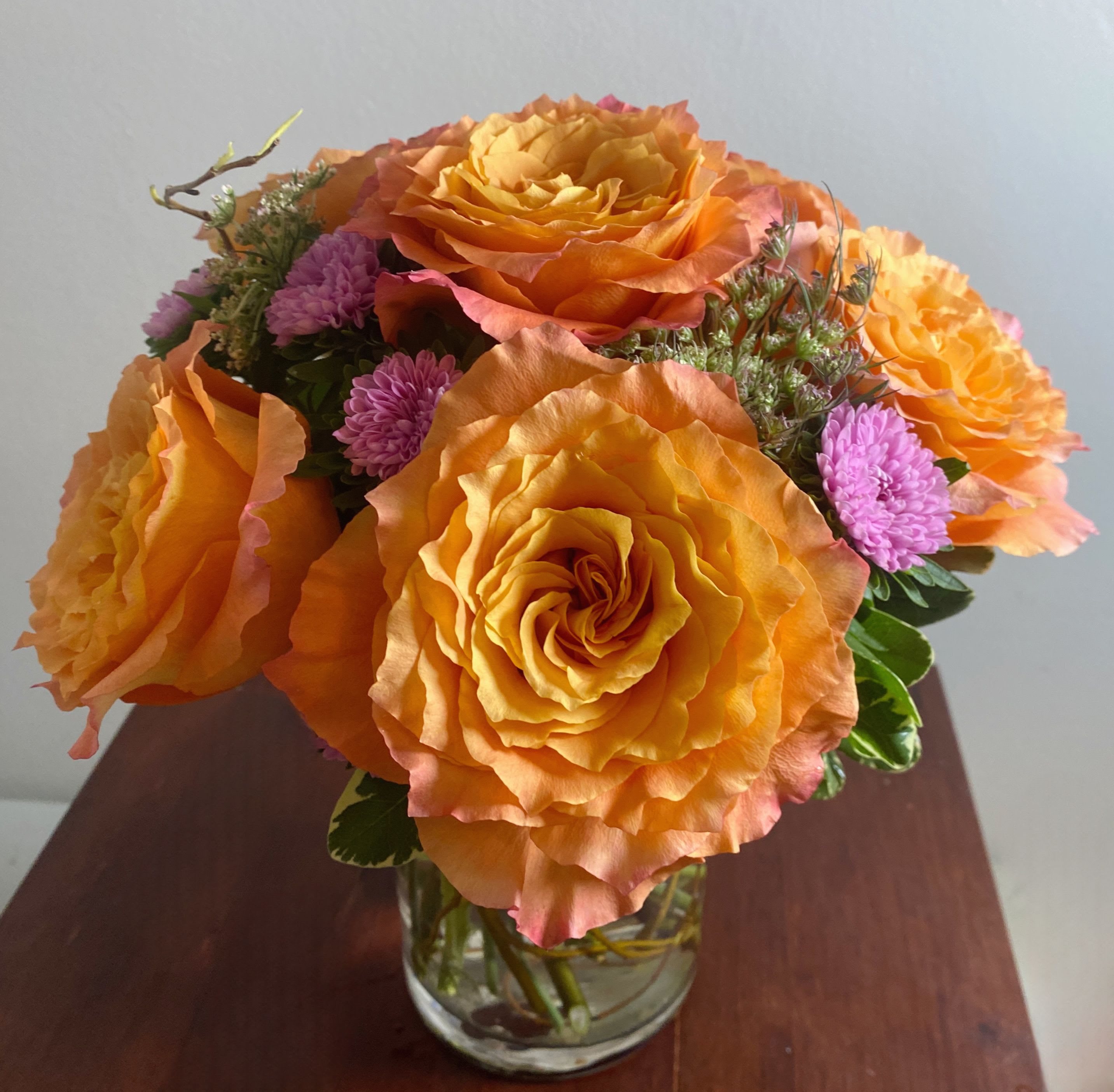 Free Spirit Bouquet  - These are our favorite roses we keep in stock for several reasons. This Rose is typically 2-3 tones in color, multi-petaled and it’s a roses that opens wide and beautifully. Perfect combination of orange,pink and coral. 