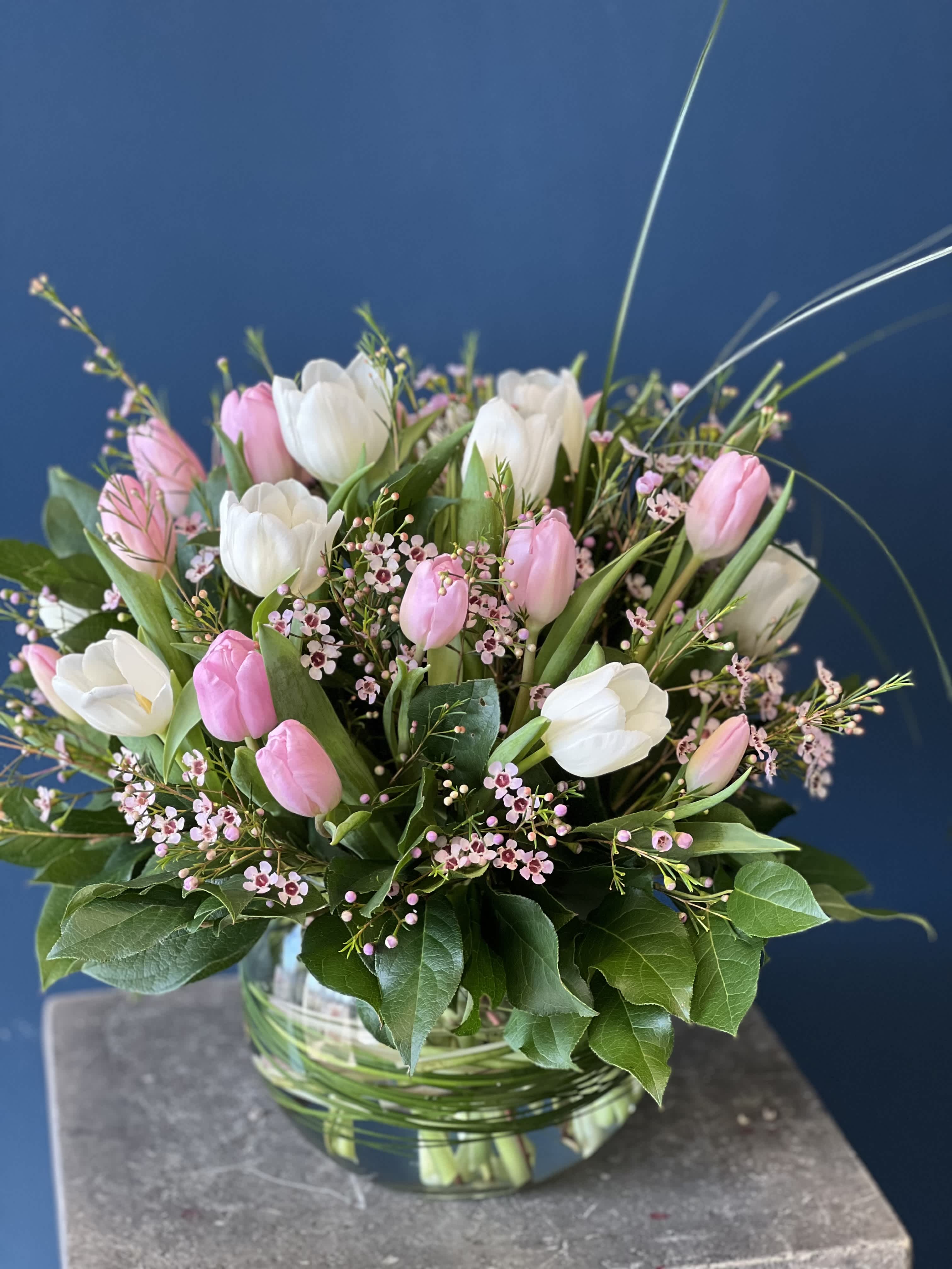 Love Is In The Air - Send a beautifully arranged assortment of Valentine Themed Tulips. These colors only will come in either white, pink, &amp; red for the holiday. Please let us know specific combination and we will mark this as a preferred combo. Specific Colors may not be guaranteed based on request.  
