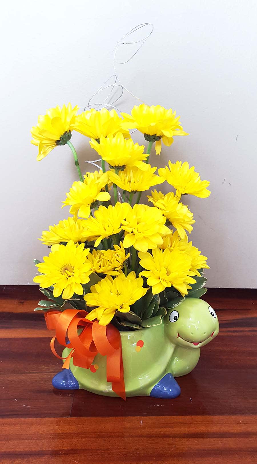 New Baby Arrangement – Varies -  Let Artistic Ambiance customize this arrangement with the colors and vase of your choice. Perfect for a new baby boy or girl!  **Please Note** Flower substitutions may occur based on availability. Floral arrangement may differ from photo pictured. We will do our best to ensure a quality floral arrangement. 