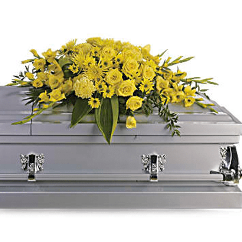 Graceful Grandeur Half Casket Cover - Joyous times and golden memories are recalled with this lovely half-couch casket spray that consoles the bereaved with a sunny array of beautiful blooms. An array of vivid flowers such as yellow roses, gladioli and chrysanthemums contrast with peaceful greens including Italian ruscus and aspidistra leaves.