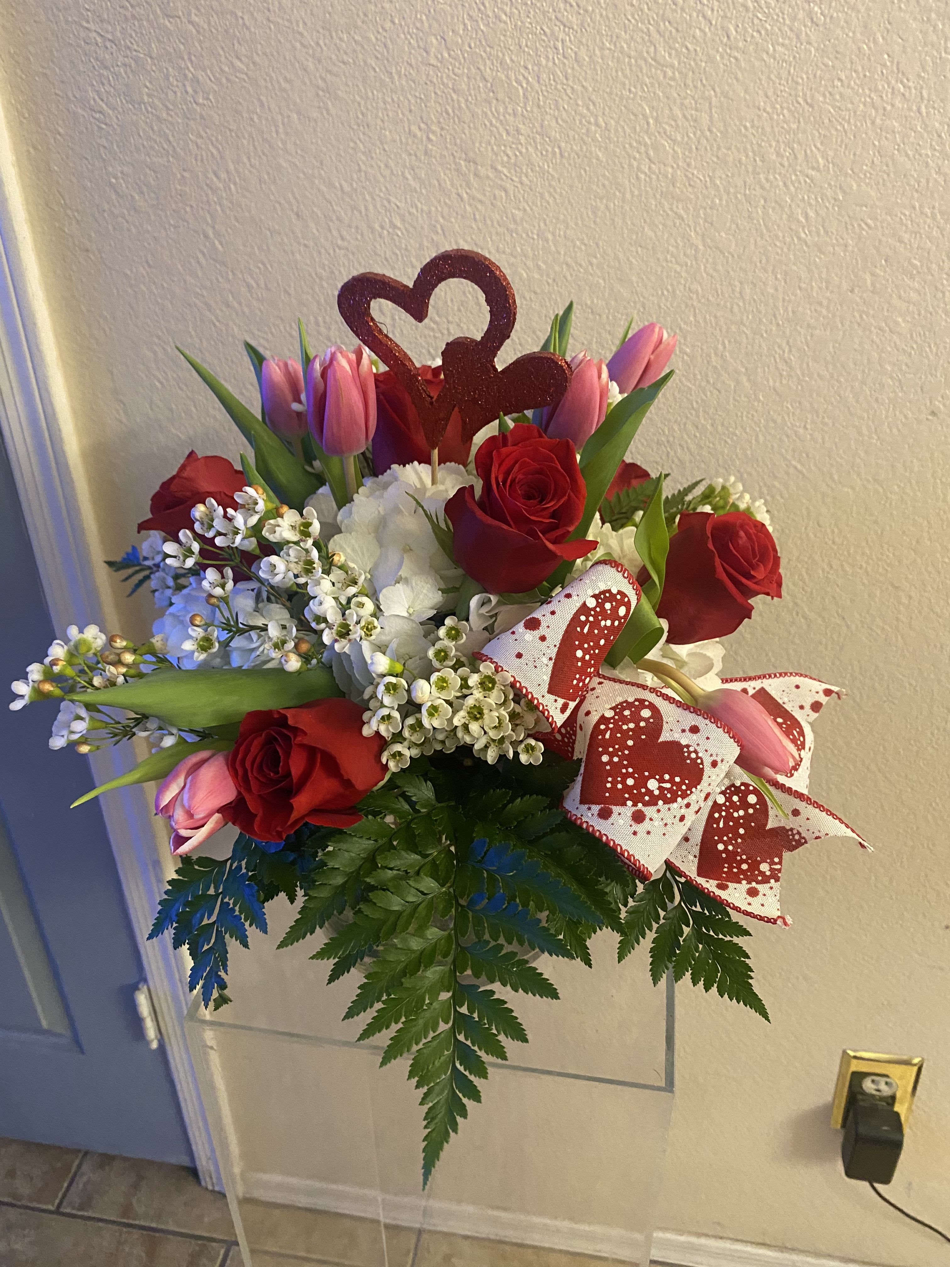 All you need is love  bouquet! - Hydrangeas, roses and tulips  I’m a large cylinder vase with a valentines heart and ribbon.  