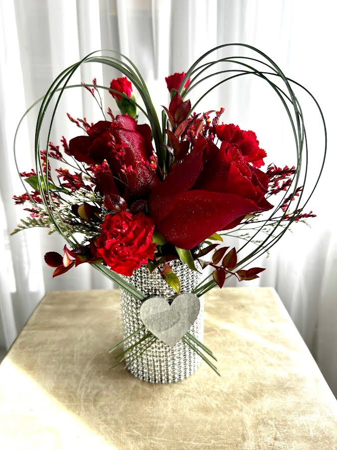 Two Sterling Roses - Two red roses, greens, and a tin-can wrapped in silver shiny wrap make a fun, inexpensive gift!  And it's environmentally friendly!