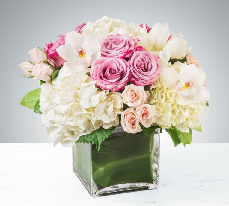 Carolina - Classic and Beautiful, this large arrangement whispers luxury. Soft pinks, whites and creams come together to create an appealingly feminine gift.   The blooms used may vary by the season and availability, and since each arrangement is custom-made to order by our talented designers, they will all look slightly different, which is what makes them so special! The photo is a representation of the overall vibe of this Botanique signature arrangement.  