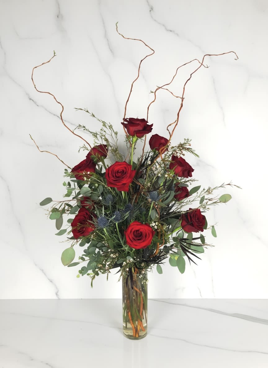 Valentine’s Day Red Rose Vase Arrangement  - Standard price is- One dozen roses Deluxe Price is- Two dozen roses Premium Price is- Three dozen roses  Roses are arranged in a tall cylinder vase with greens. If you have a rose color preference leave us a note, and we will try our best to accommodate your request.  Valentine's Day Delivery- We cannot guarantee delivery times over the Feb 13/14th. We will not be calling recipients before we make deliveries. We will ring the bell on arrival and if no one answers we will call or send them a text with a picture of the location of the arrangement.