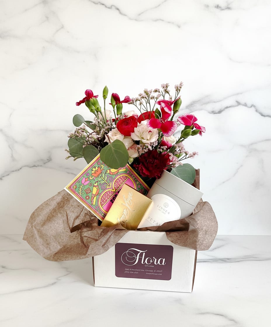 Valentine’s Day Gift Bundle - Treat your loved one to our Valentine’s Day Gift Bundle! Our gift bundle includes:  - A festive Valentine’s Day flower arrangement  - DeBrand Milk Chocolate Bar  -  Seasonal winter-scented Linnea's Lights seasonal double-wick candle - Blank romantic greeting card from Redcap cards  Valentine's Day Delivery- We cannot guarantee delivery times over the Feb 13/14th. We will not be calling recipients before we make deliveries. We will ring the bell on arrival and if no one answers we will call or send them a text with a picture of the location of the arrangement. 