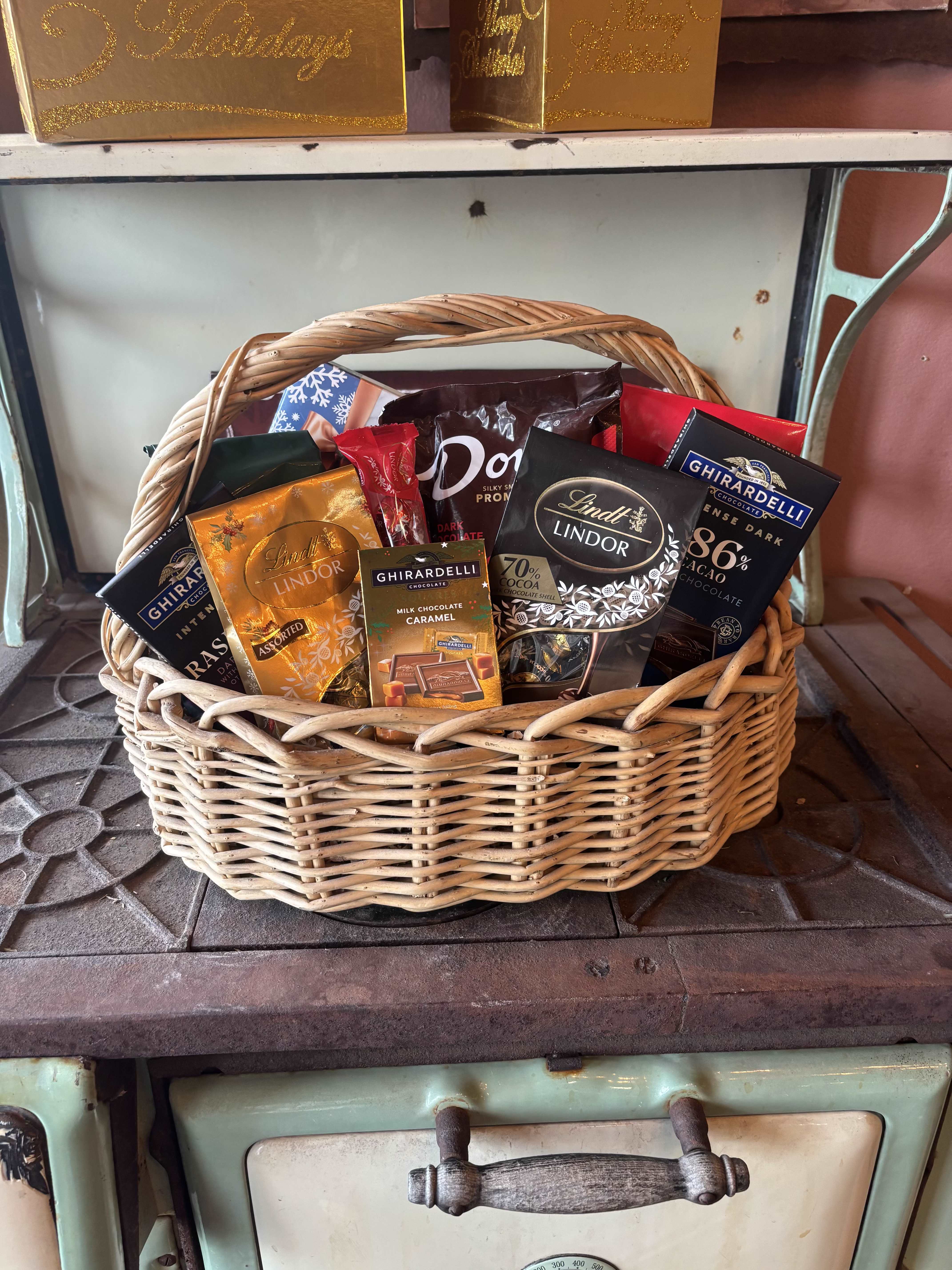 Luxurious Indulgence - Elevate any occasion with Luxurious Indulgence, a thoughtfully curated gift basket designed for true connoisseurs of comfort and refinement. This charming gift basket features a premium bag of coffee, perfectly paired with an exquisite assortment of gourmet chocolates - from rich, velvety dark varieties to smooth, decadent milk chocolate favorites. Each element is selected to create a moment of pure indulgence, making this gift ideal for celebrations, a heartfelt thank-you, client appreciation, or simply treating someone special.  Please note: This item may require additional lead time so same-day delivery is not available.