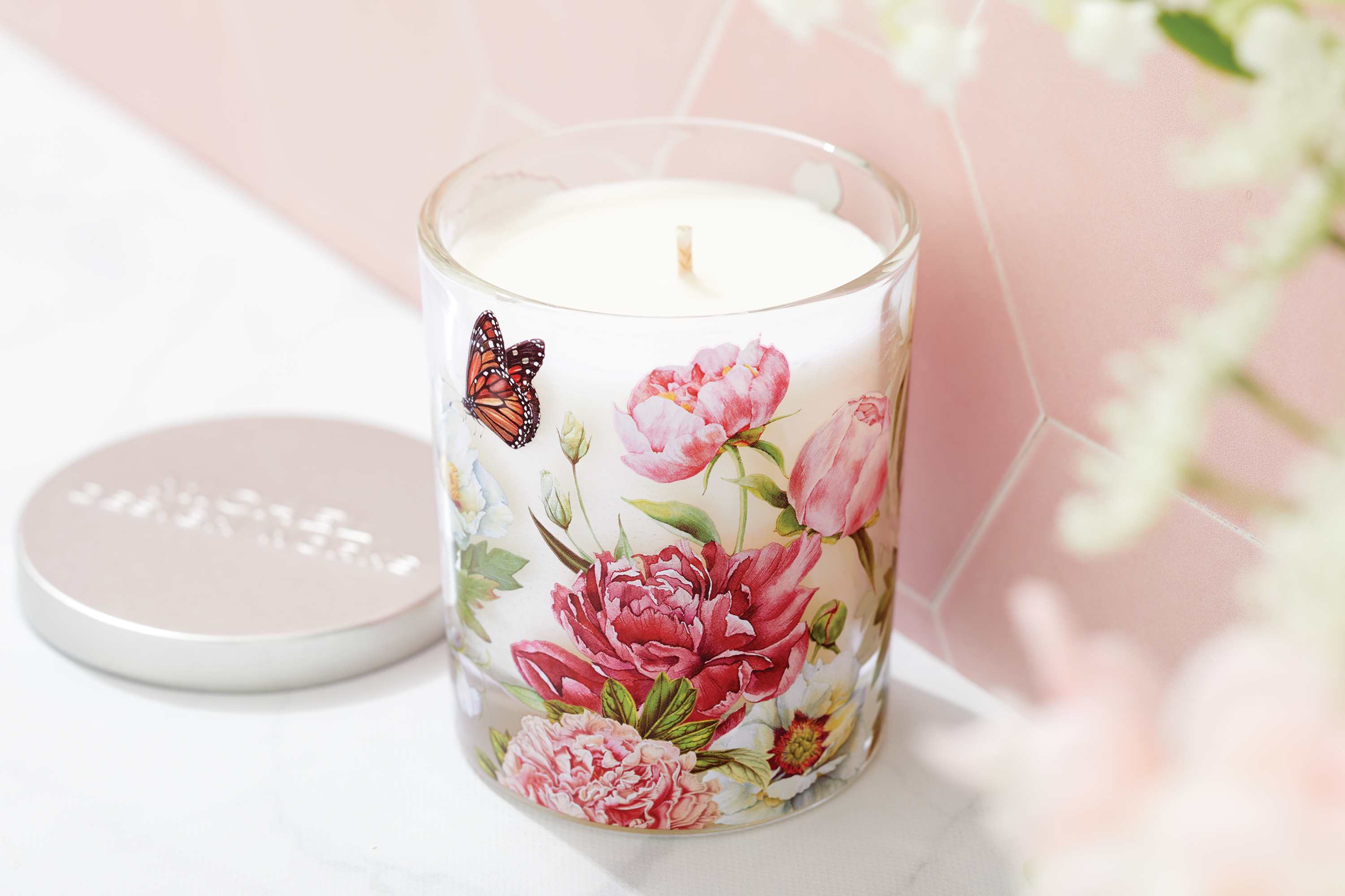 Blush Peony Decorative Glass Jar Candle - Forever classic, showy peonies in all their pastel glory bring a touch of elegance and romance all year round.  Fragrance: Aromatic Peony with a hint of mandarin, notes of gardenia, and touches of cedar and sandalwood.  Our all-natural, decorative jar candle is nontoxic, biodegradable and clean burning, made from a sustainably sourced soy and palm oil wax blend.   7.4 oz/209 g 38 hrs. approximate burn time
