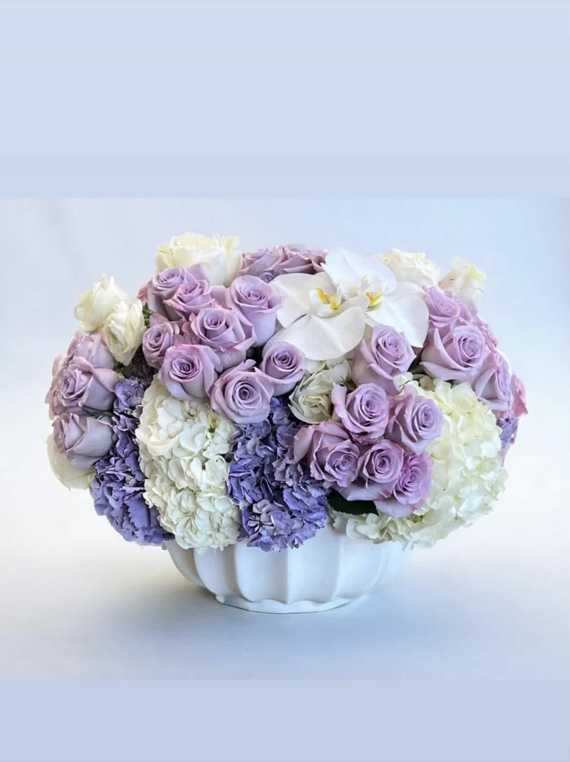 Moonchild - A soft glow of light purples and white, with Roses, Phalaenopsis Orchids, and Hydrangea
