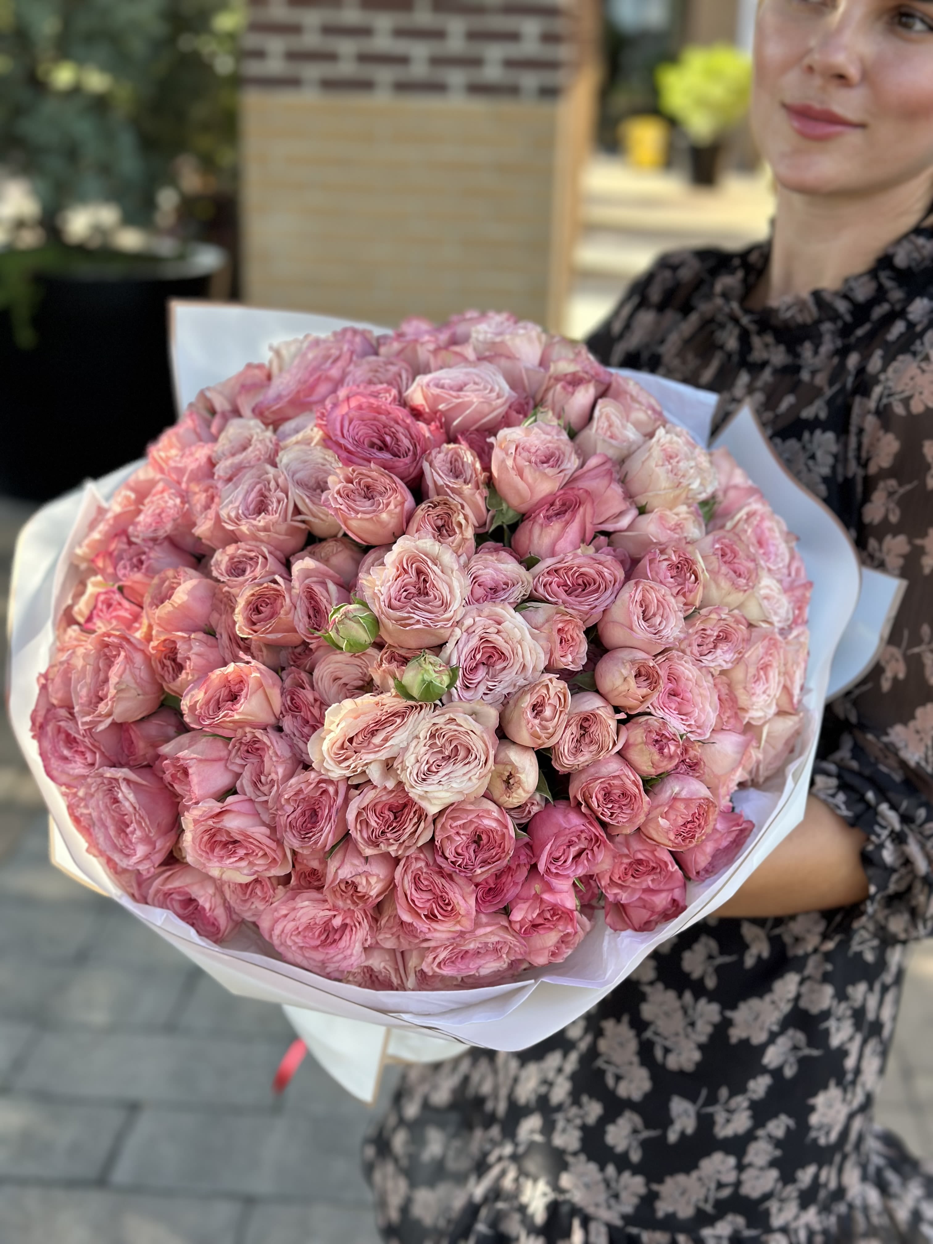 Étreinte de Roses - A breathtaking bouquet of lush garden roses in tender shades of pink, curated to express deep affection and timeless beauty. Each bloom whispers softness, romance, and elegance — perfect for heartfelt moments, grand gestures, or simply to say “you are cherished.” Wrapped with care, this floral embrace is a true celebration of femininity and grace.