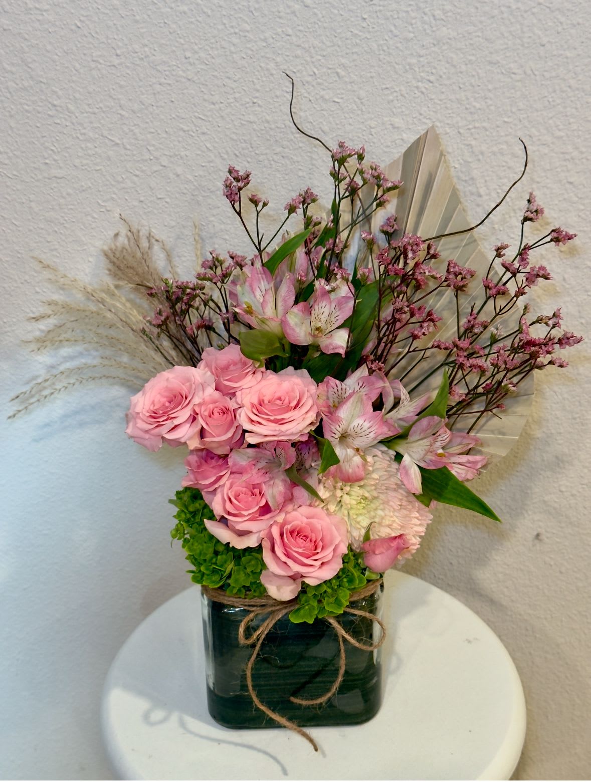 Bliss Pure Blush  - A refined arrangement of soft pink blooms designed to captivate at first glance. Elegant, timeless, and beautifully balanced, this piece delivers a graceful expression of care, admiration, and sophistication—perfect for any occasion that deserves something truly special.