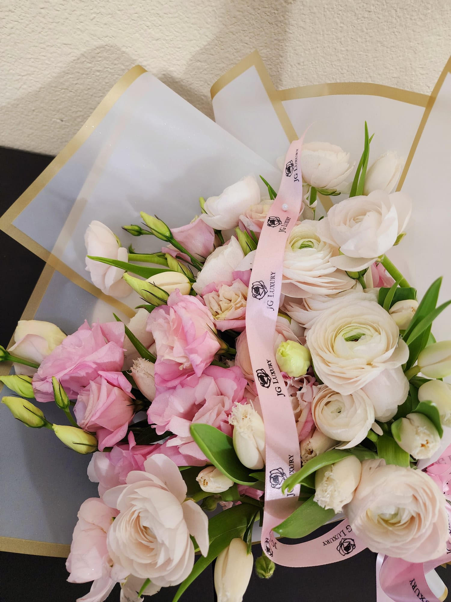 Sweet Cotton - Delicate arrangement made with love, blending soft pink lisianthus, graceful white tulips, and lush ranunculus for a elegant fresh touch.