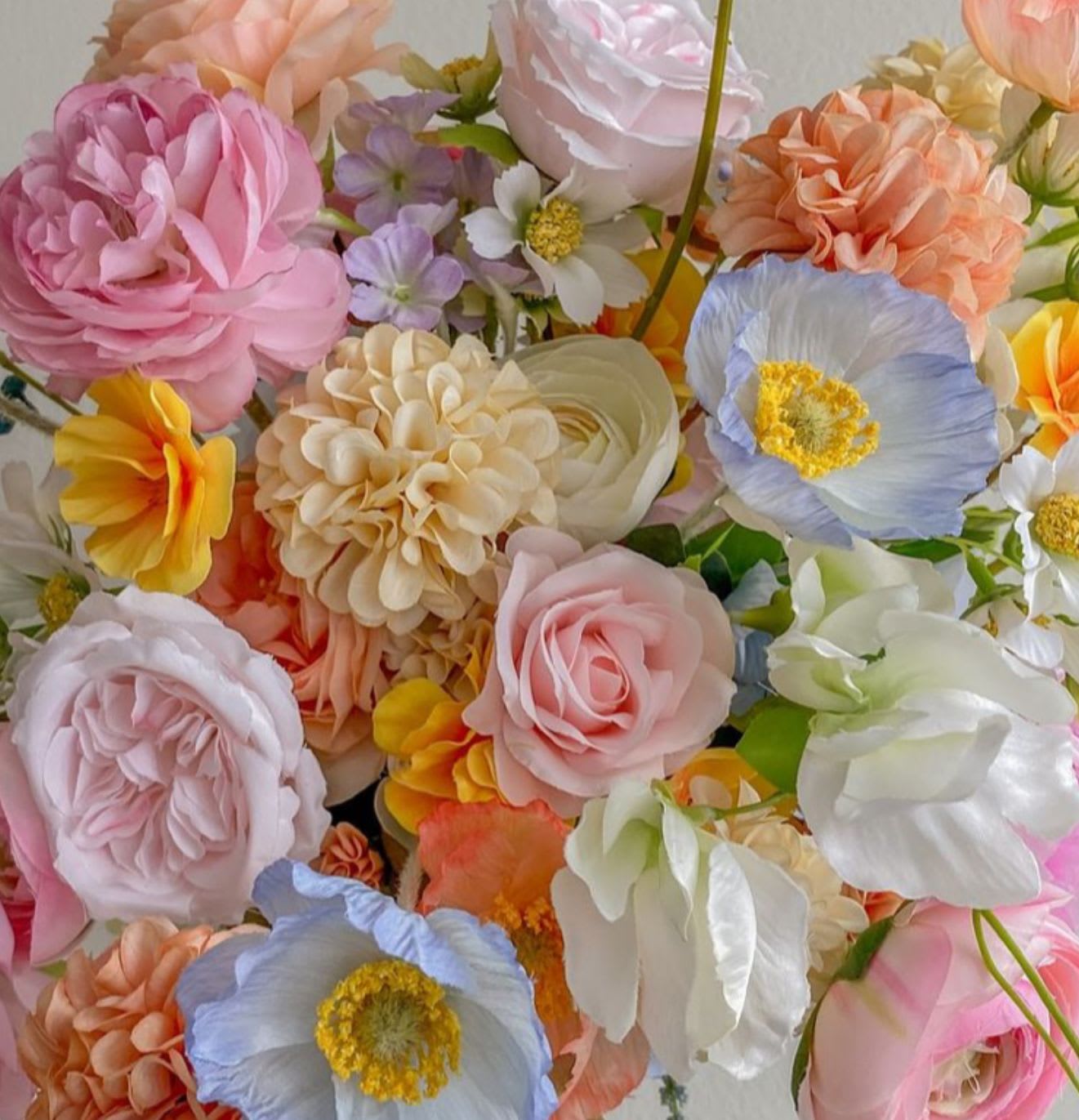 Designer’s Choice in Soft Pastels - Designer will create a beautiful  custom floral arrangement using the best soft and pastel flowers of the season. 