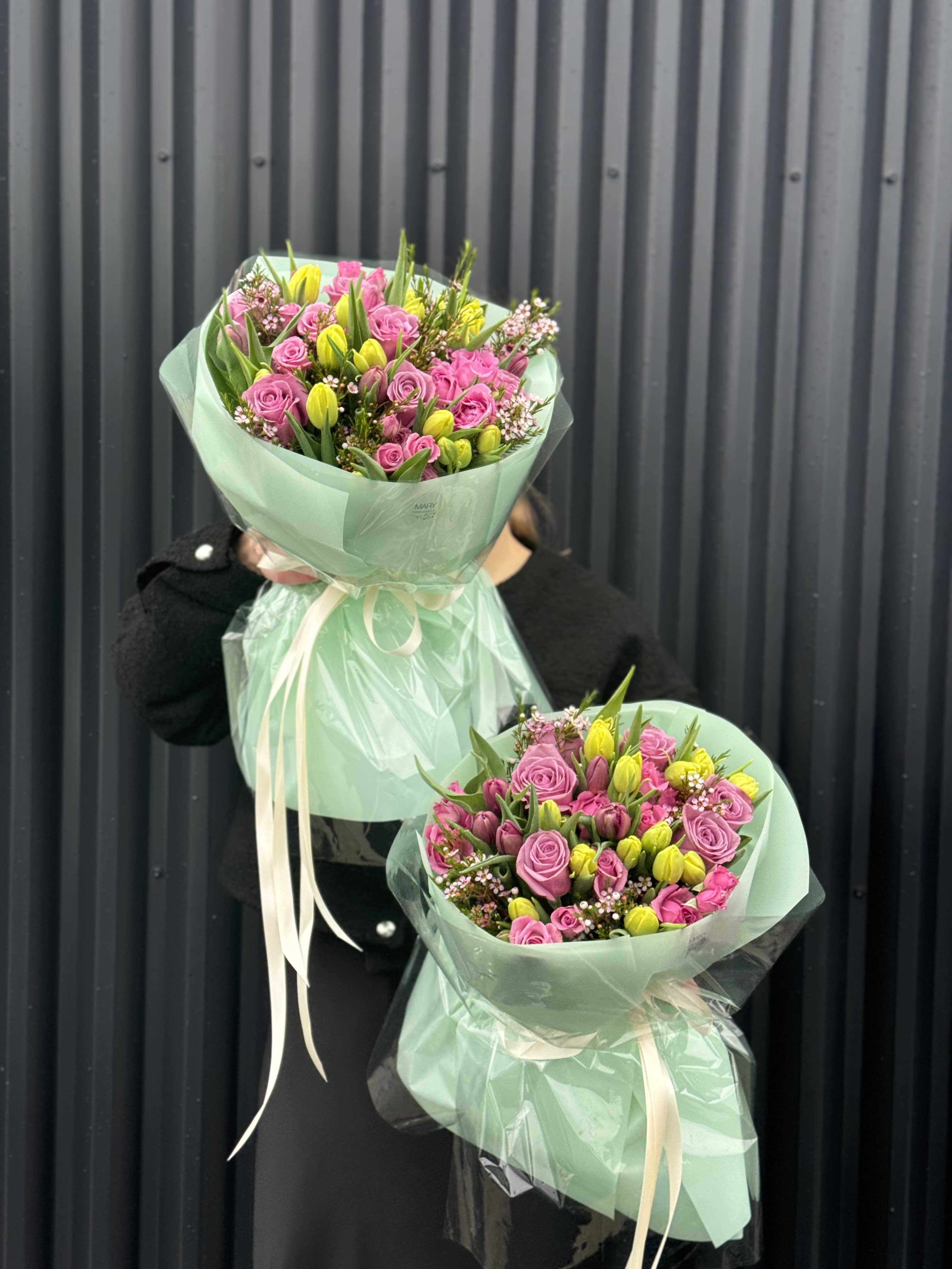 bouquet with purple tulips in green packaging - bouquet with purple tulips in green packaging