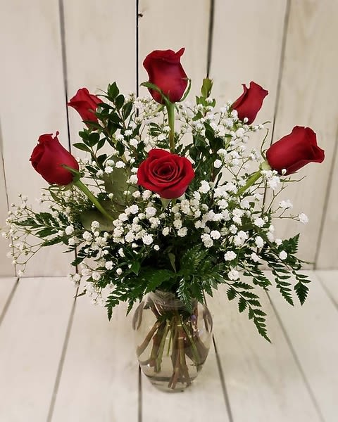 Half Dozen Roses Vase Arrangement  - Half Dozen Long Stem Beautiful Roses nestle in greenery. The perfect way to send a smile, love or hug! 
