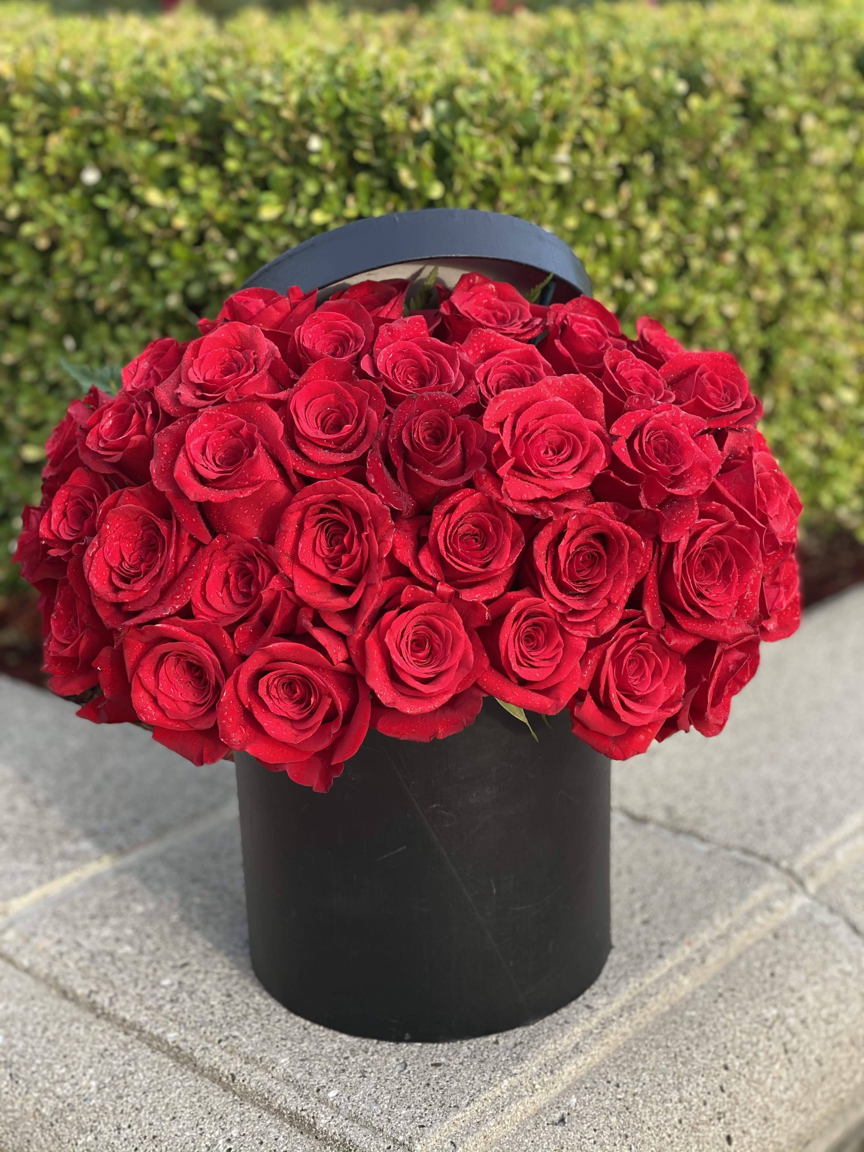 Red roses - An unforgettable statement of love. This stunning arrangement features 45 premium long-stem roses, artfully designed to make a bold and romantic impression. Shown in classic red, this design can be customized in any color of your choice to perfectly express your love. Pink roses, lavender roses, yellow roses, white roses, or orange roses delivered in Rancho Cucamonga and other local areas 