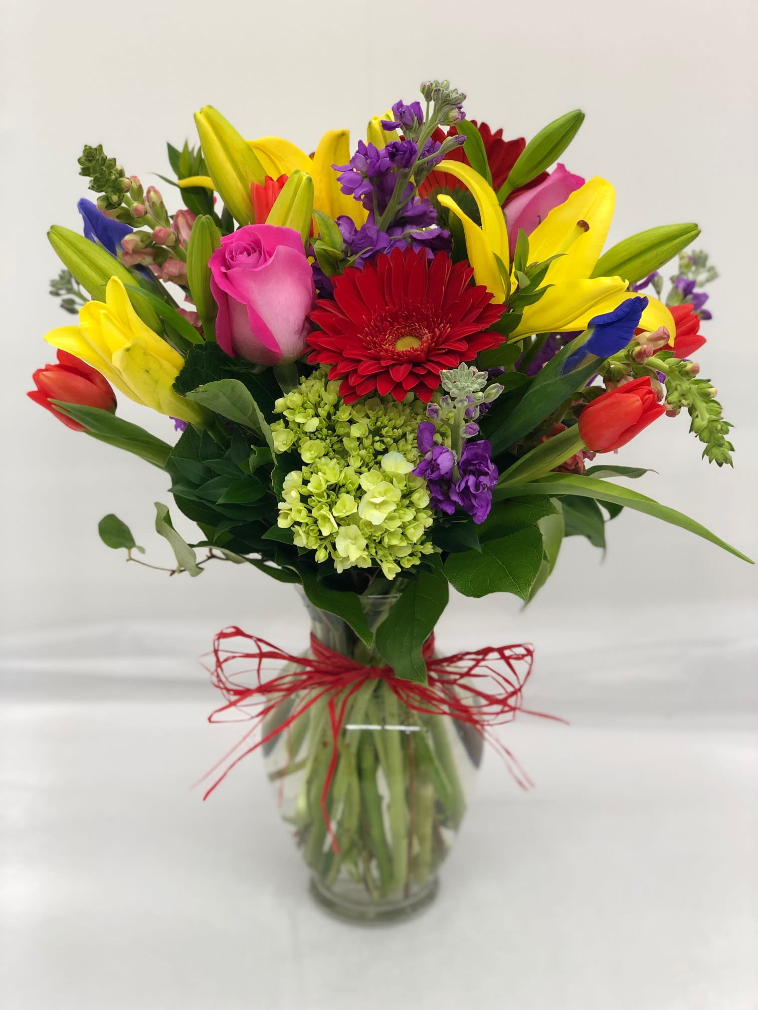 Colors Of Love Bouquet - Bright and cheery with all of the colors of love! For the brightest person you know (: Assortment of lilies, tulips, gerbers, iris, hydrangeas, stok, roses, snapdragons, etc...   Flowers and color may vary depending on availability in order to keep same scheme/style.