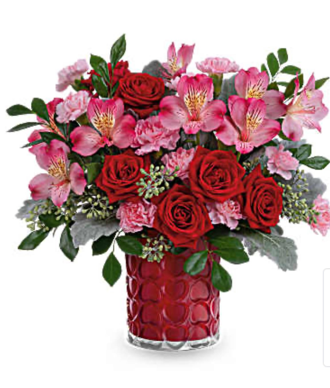 Enchanted Hearts T - Adorned with a charming heart pattern and gleaming with a pearlescent finish, this delightful glass vase adds an extra touch of magic to their Valentine's Day when filled with a stunning red and pink bouquet.