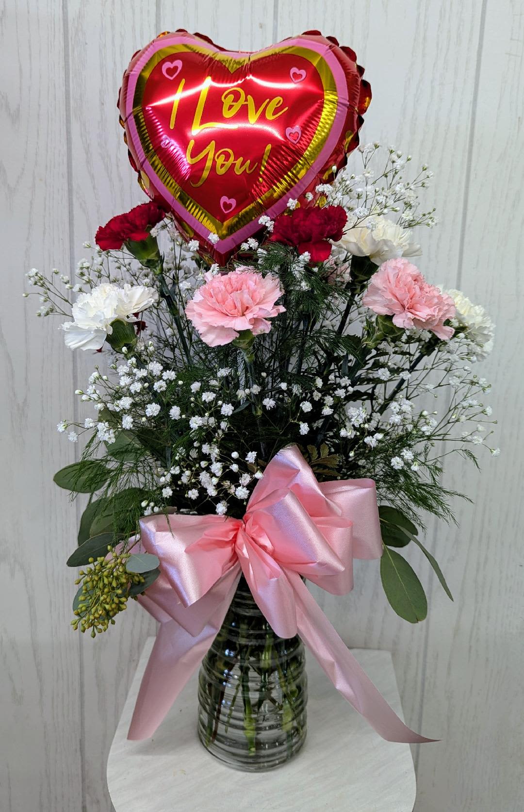 Love You Lots - 1 Dozen Mixed Carnations w/air-filled mylar - 1 dozen mixed carnations with babies breath, bow and accented with an 8 inch air-filled mylar on a pick with an I Love You message. (mylar style maybe different than what is shown, but will have an "I love you" message on mylar) 