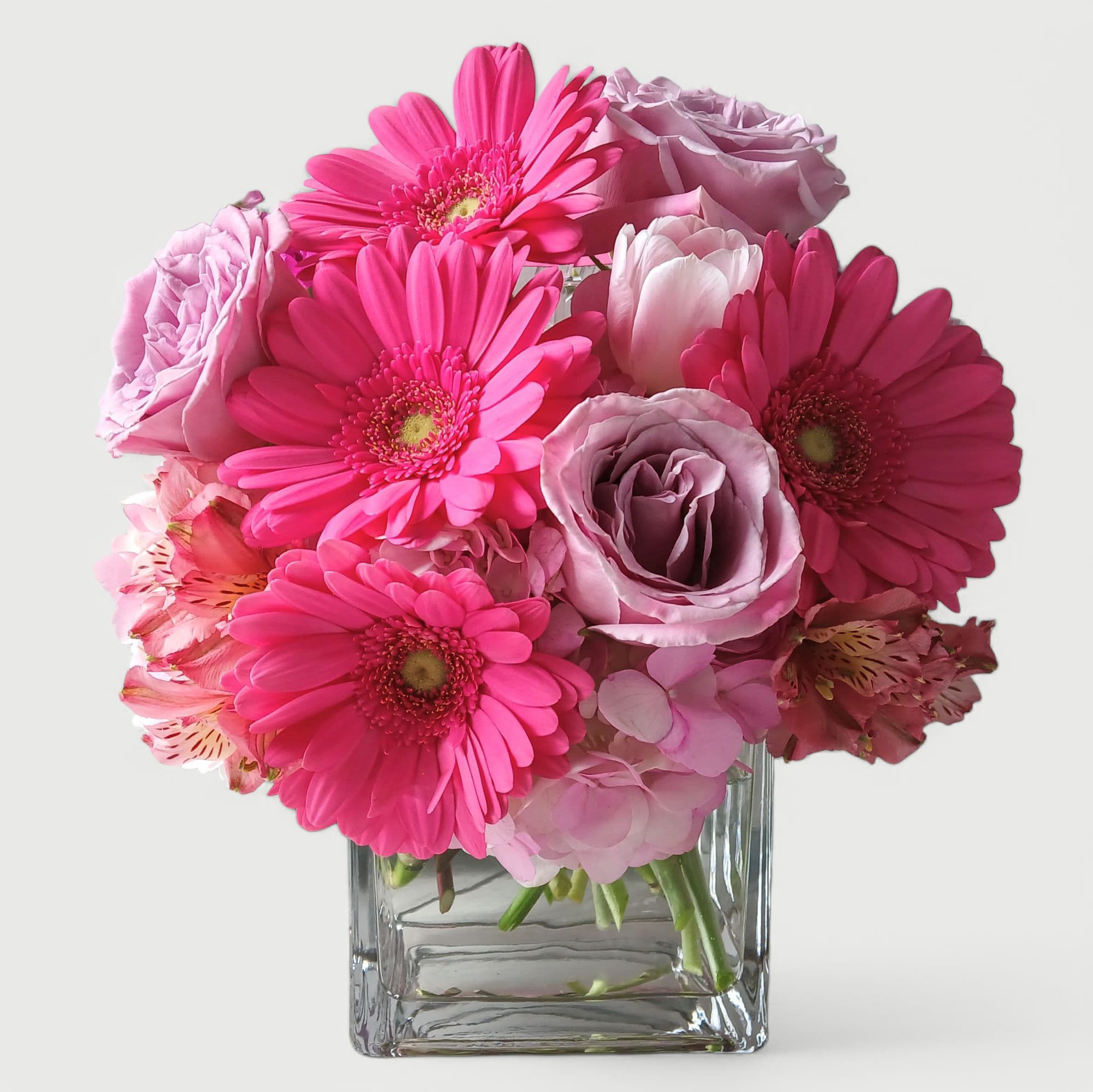Pink My Favorite Bouquet - Send this beautiful all pink bouquet today to make them smile with it's lovely mixed roses daisies and more arranged in a modern glass cube style vase. Cheerful and perfect for every reason to brighten up their day.