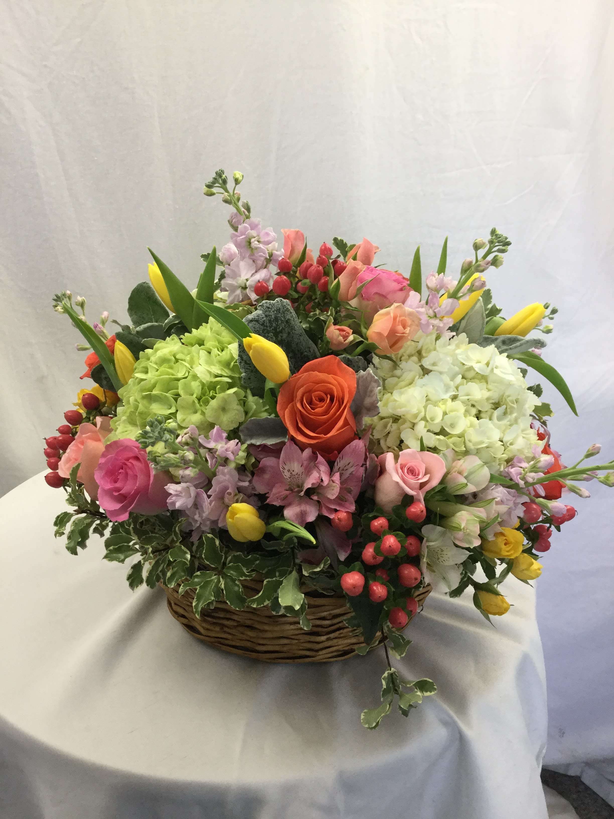 Mixed Spring Basket  - Send this beautiful basket arrangement to a loved one today! Makes for a wonderful gift during the Spring and Summer Seasons. Full of fresh blooms, fresh greenery and hand-crafted and designed in a beautiful brown basket.
