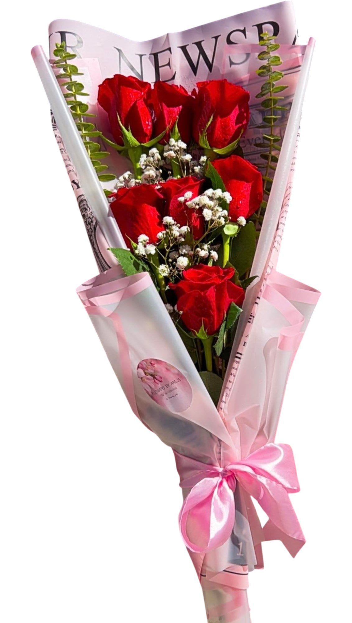 Mini Red Rose Bouquet - Mini Red Rose Bouquet  Classic red roses wrapped in soft pink paper and tied with a satin bow—perfect for romantic surprises, anniversaries, birthdays, or just because. Fresh, elegant, and thoughtfully designed for a sweet gesture that speaks from the heart.  Keywords: red roses, rose bouquet, romantic flowers, anniversary flowers, birthday flowers, love roses, Valentine’s flowers, fresh flowers, same-day flower delivery, local florist, flower gift, mini bouquet 