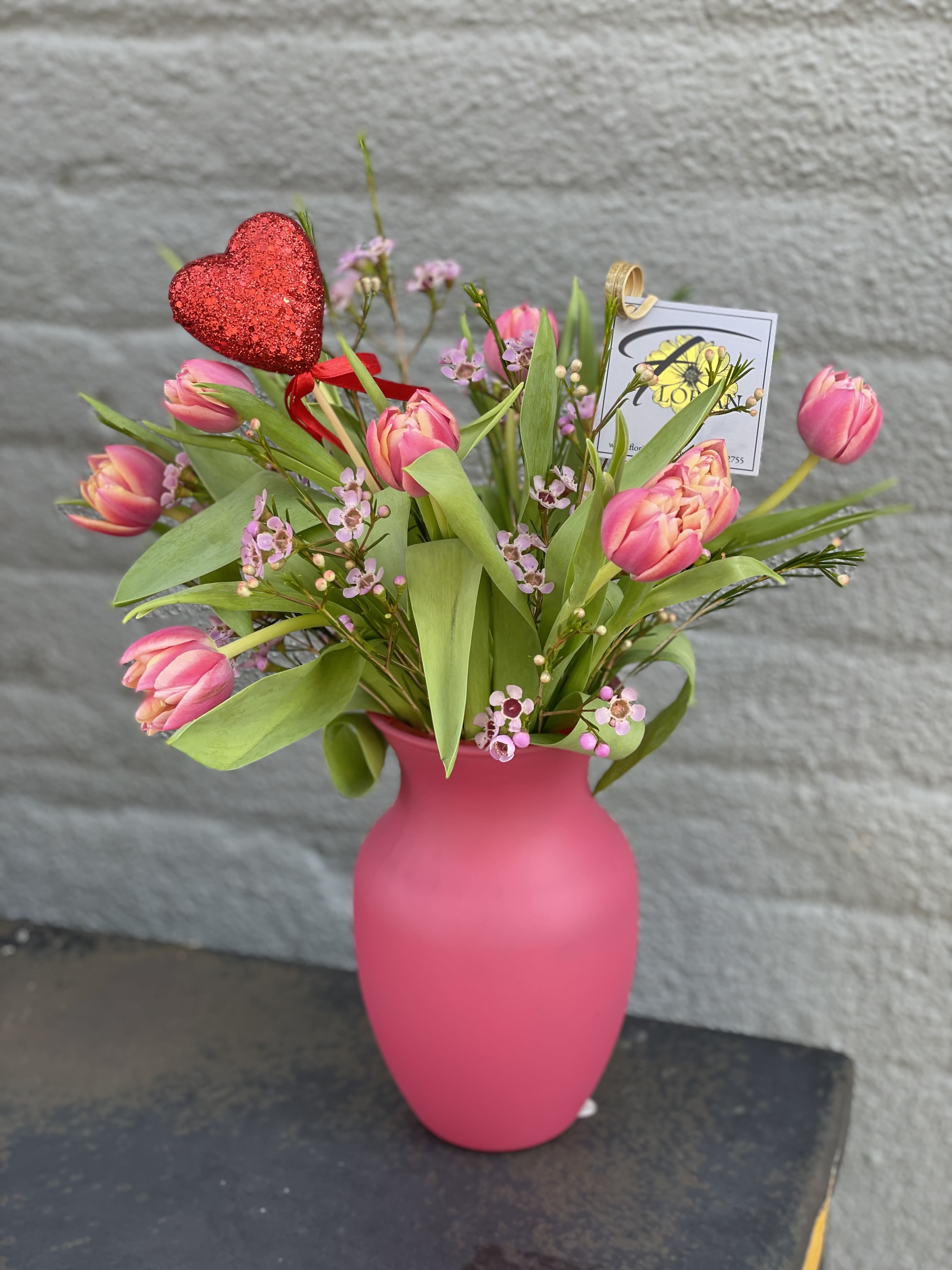 Love Runs Deep - Did you know that Tulips represent a perfect and deep love? They do! So surprise your Valentine with tulips a plenty. This arrangement is chock full of specialty tulips, waxflower, and other fillers. Colors may vary! AVAILABLE for Valentine's Week Only!