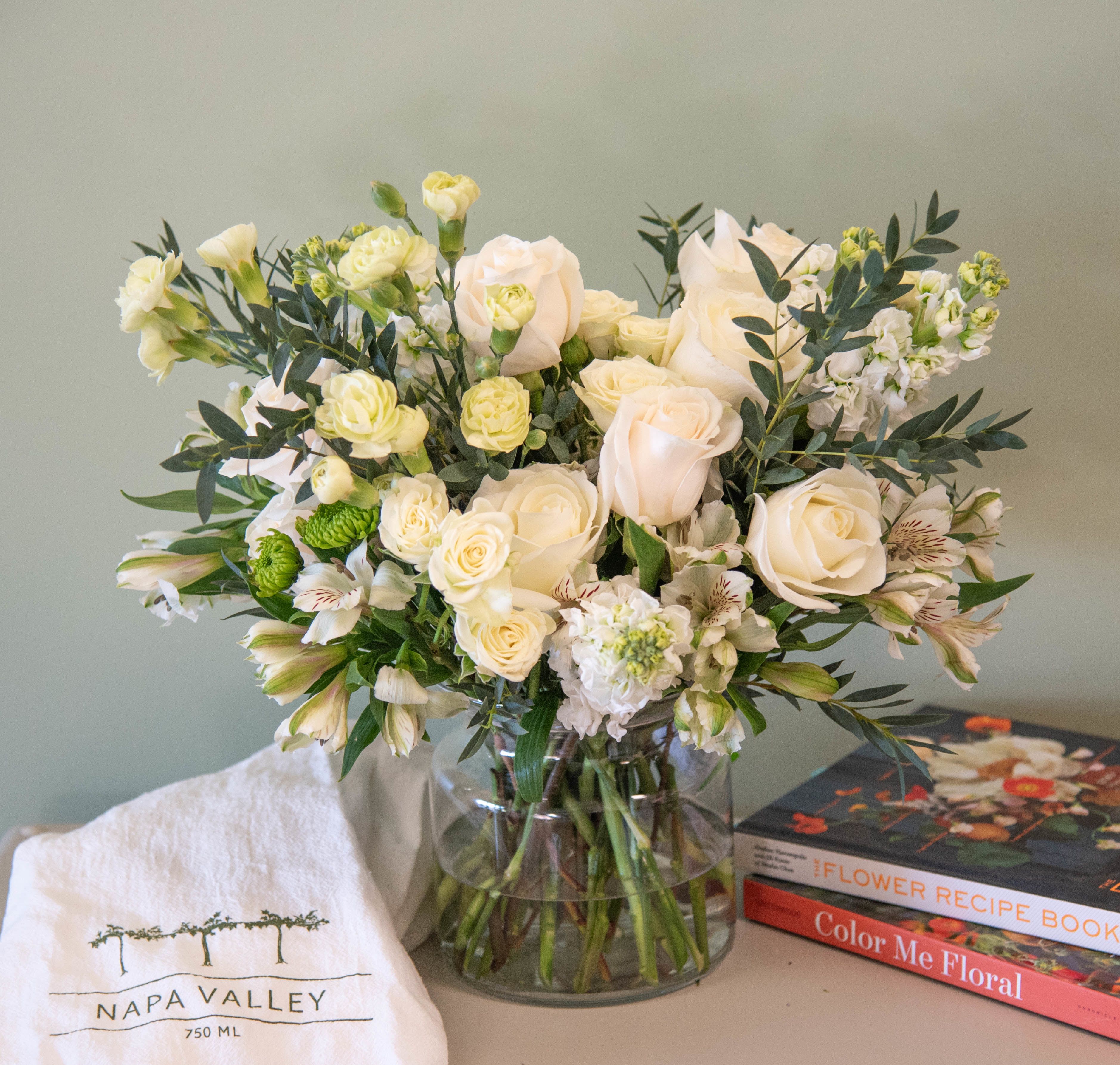 With Love - An Arden Road Signature design, this flower arrangement is created delicately with white flowers and greenery. 