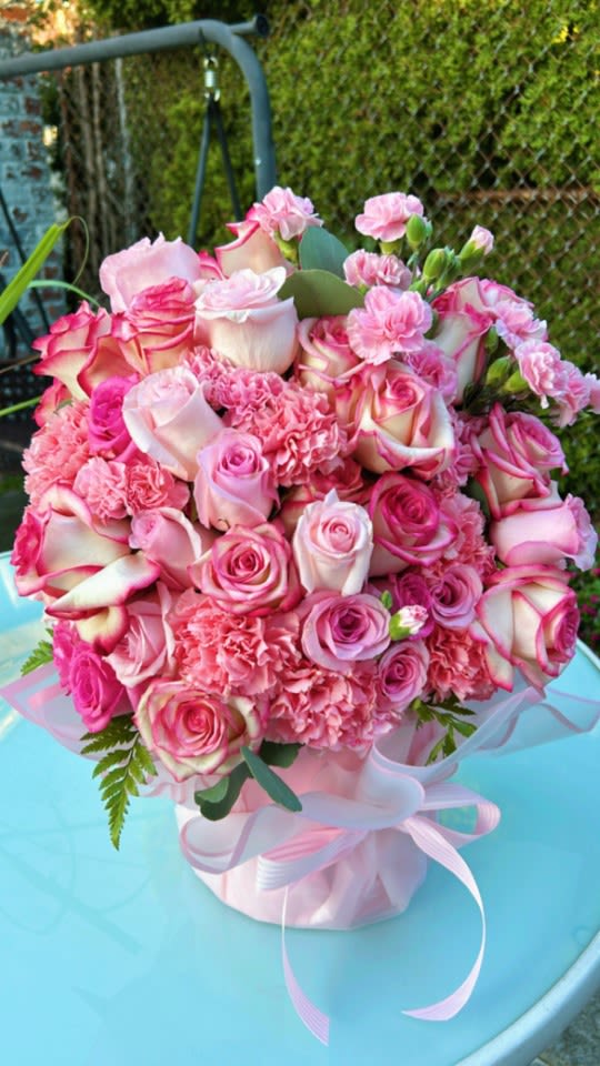 Rose Garden Flower Box - Assorted pink toned roses and carnations paired with vibrant greenery in a large arrangement flower box.