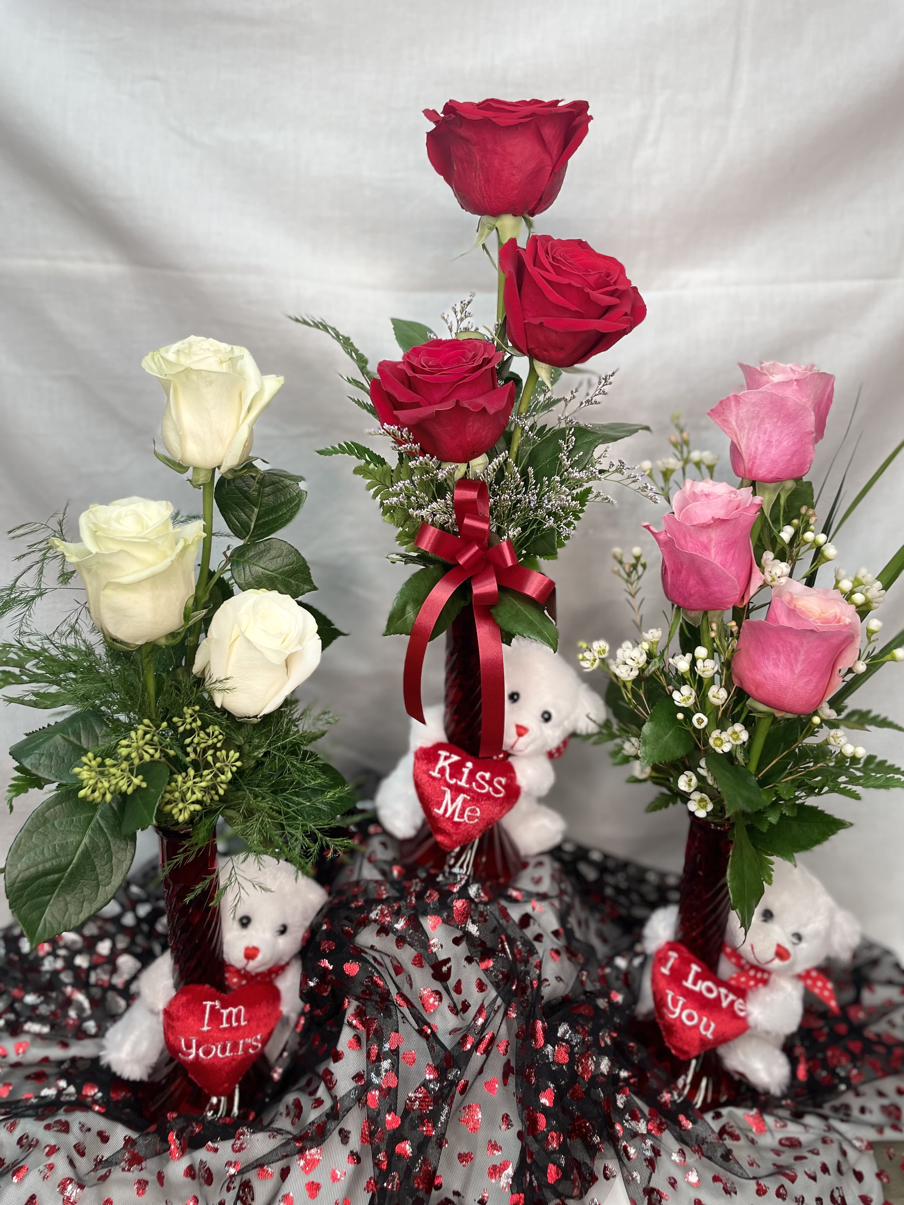 Sweet Thoughts Bear Bud Vase - Beary sweet! Celebrate her with this adorable bear hug bud vase. It contains three roses (you chose color...Red, Pink, or White) filler and assorted greens.  **This is a SINGLE BUD VASE not all three pictures