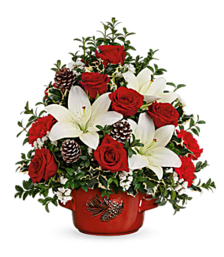 Teleflora's Christmas Lilies Tree Bouquet - Deck the halls with classic Christmas style! This pretty topiary of snow white lilies and delicate boxwood looks oh-so-festive inside a vintage stoneware serving dish. This festive arrangement features red carnations, white asiatic lilies, white sinuata statice, English boxwood and variegated holly. Delivered in Teleflora's Vintage Stoneware Bowl. Orientation: All-Around