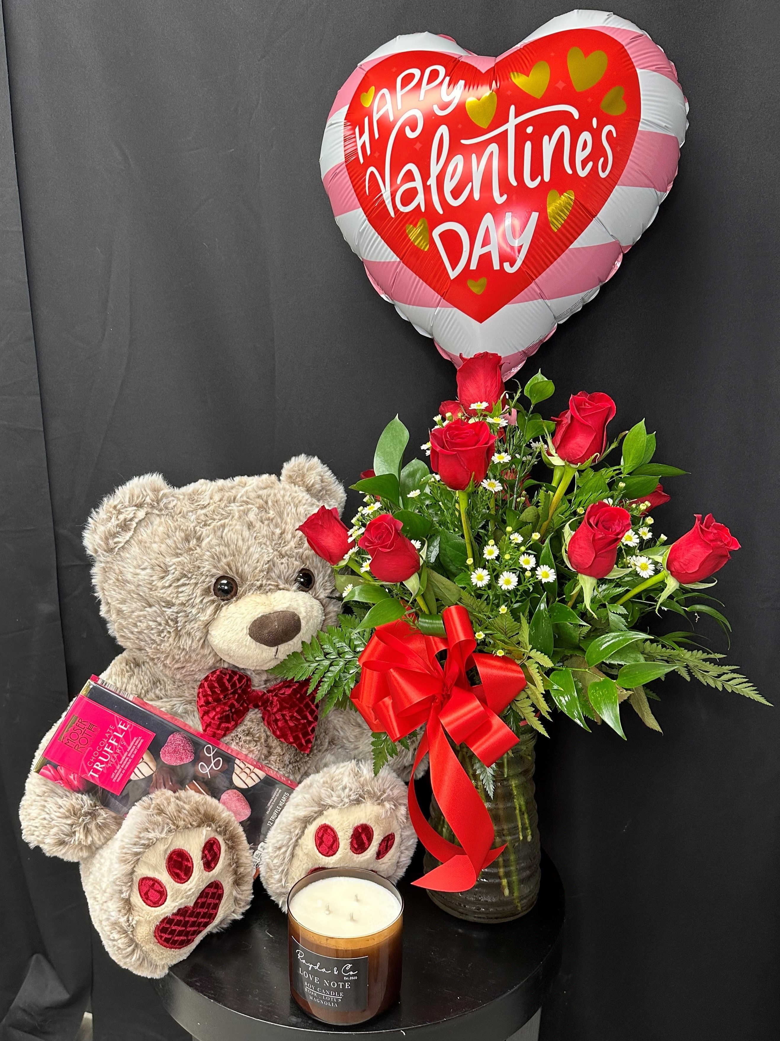 Ultimate Valentine's Day Bundle - Give your Valentine the Ultimate surprise with this one of a kind bundle of a Dozen Red Roses, Extra Large Teddy Bear, Delicious Chocolate Truffles, Hand Made Soy Candle, and a Valentine's Balloon.  