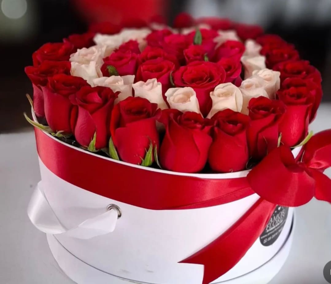 Classic Love Roses - This Luxurious 36 heart-shaped rose box features premium fresh red roses accented with elegant white roses, beautifully arranged in a classic keepsake box and handcrafted by Snyder Flowers, a trusted florist in San Antonio TX. Perfecto for Valentine's Day, anniversaries, proposals or romantic surprises, this arrangement is ideal for customers searching for luxury rose boxes in San Antonio, romantic flower delivery, or a high-end San Antonio flower shop offering same day flower delivery. A timeless symbol of love, passion and elegance.