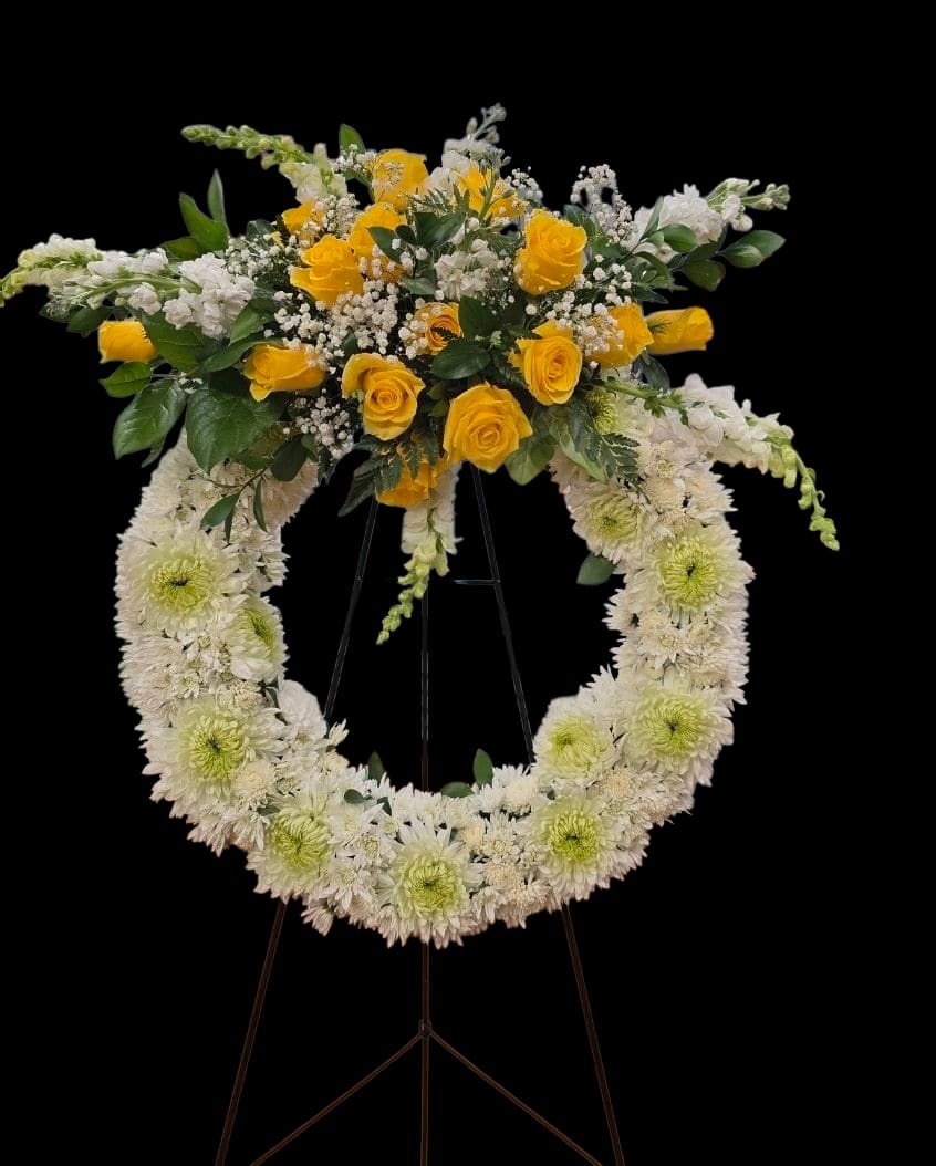 Golden Remembrance Wreath - A graceful sympathy wreath symbolizing everlasting love and cherished memories, featuring a serene ring of soft blooms accented with warm golden florals and gentle greenery—offering comfort, honor, and peace during a time of remembrance.