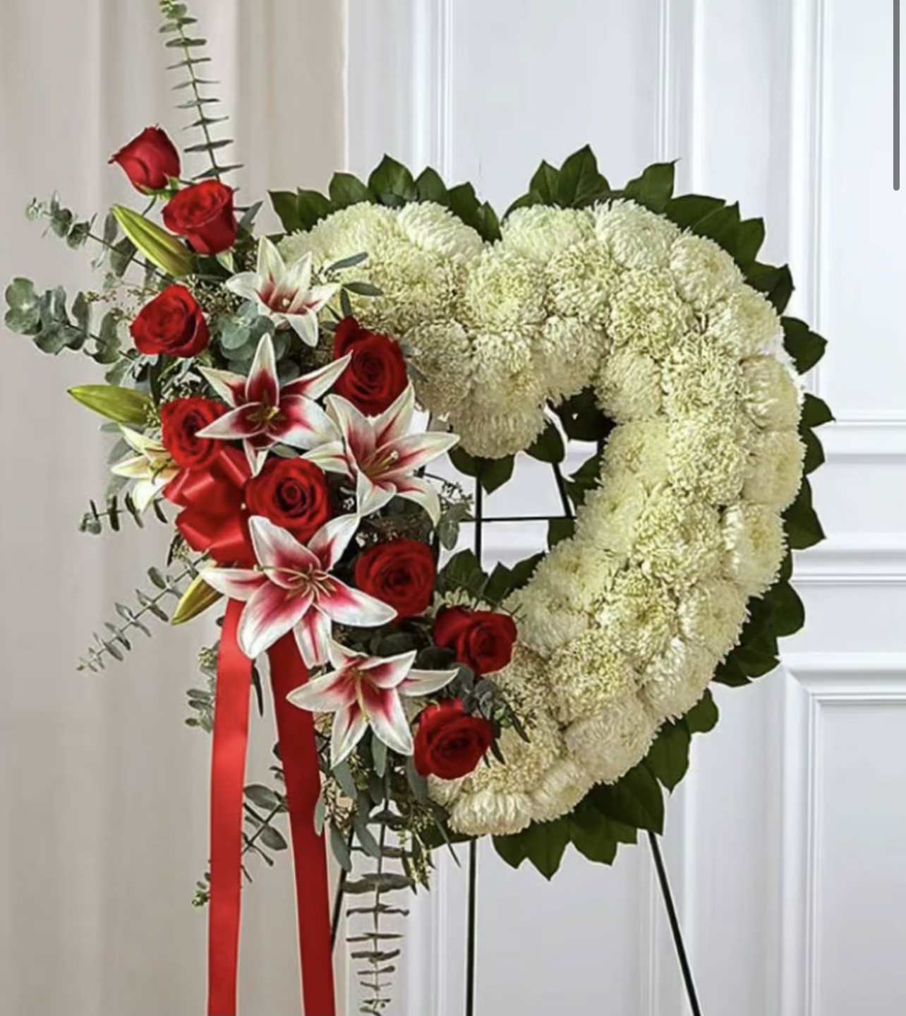 Elegant Reds Heart Wreath - Red and white roses with red liliies.