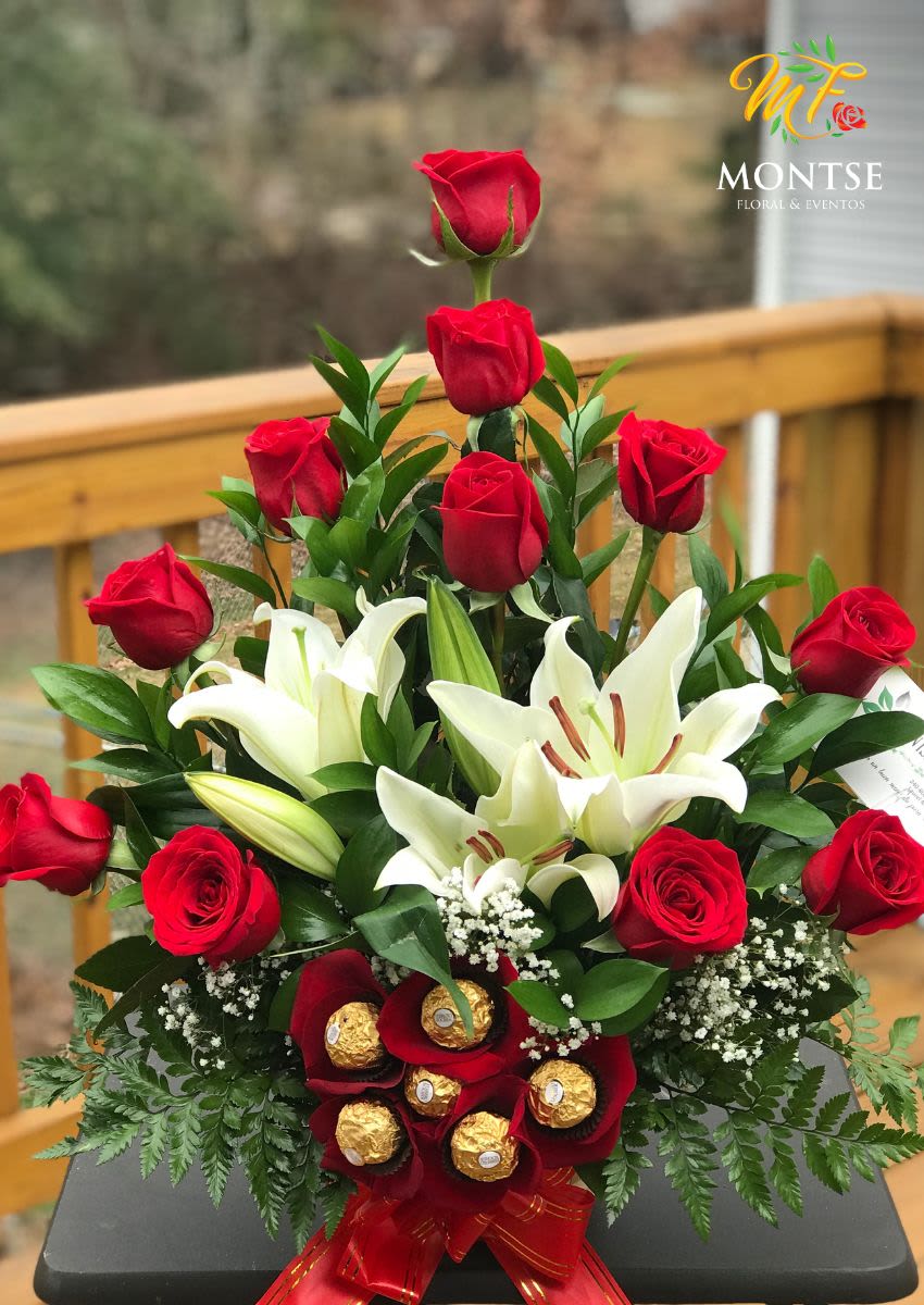 cute   - 11 roses with white lilies , greens and babys breath include half dozen of ferrero rocher on a wet foam 