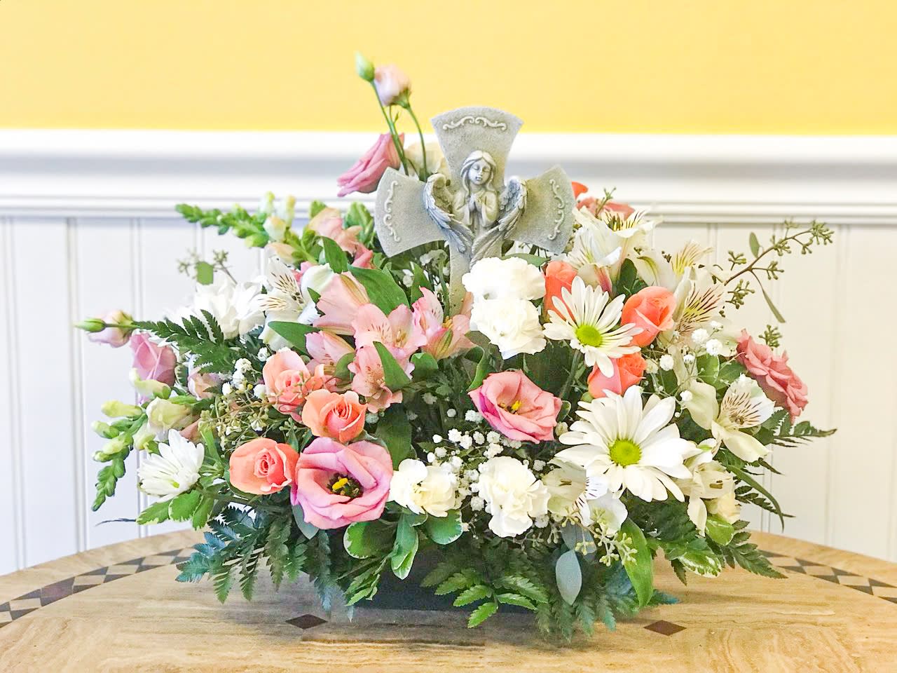 Divine Garden - Pink - Saying goodbye is always a challenge. Flowers are always an acceptable way to show your condolences. This beautiful, soft flower arrangement has white and pink flowers surrounding a poly-resin cross with a guardian angel silhouette. 