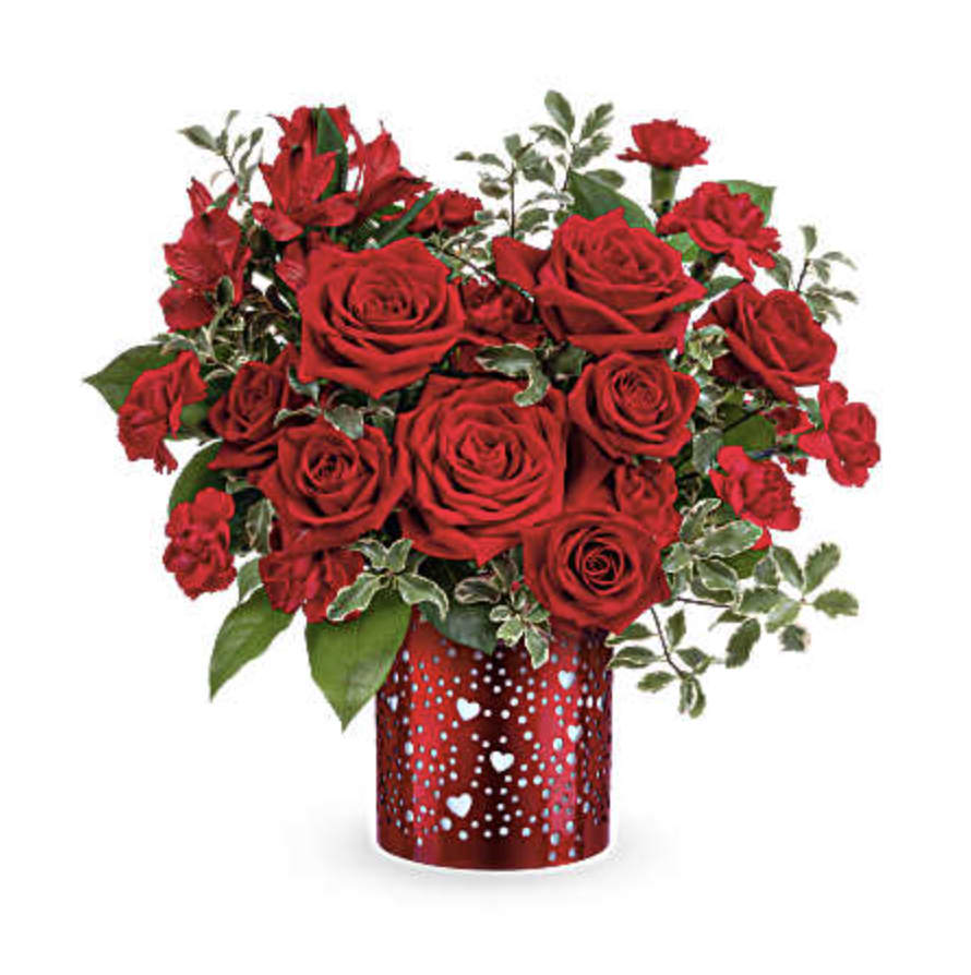 I Heart You Bouquet - Let your love shine with I Heart You Bouquet, featuring a passionate mix of red roses, alstroemeria, and carnations arranged in a red metal lantern adorned with charming heart and dot cutouts-a heartfelt Valentine's Day keepsake. I Heart You Bouquet includes red roses, red spray roses, red alstroemeria, red miniature carnations, lemon leaf, beautifully arranged in this I Heart You Lantern, a red metal lantern with heart and dot cutouts. Orientation: All-Around