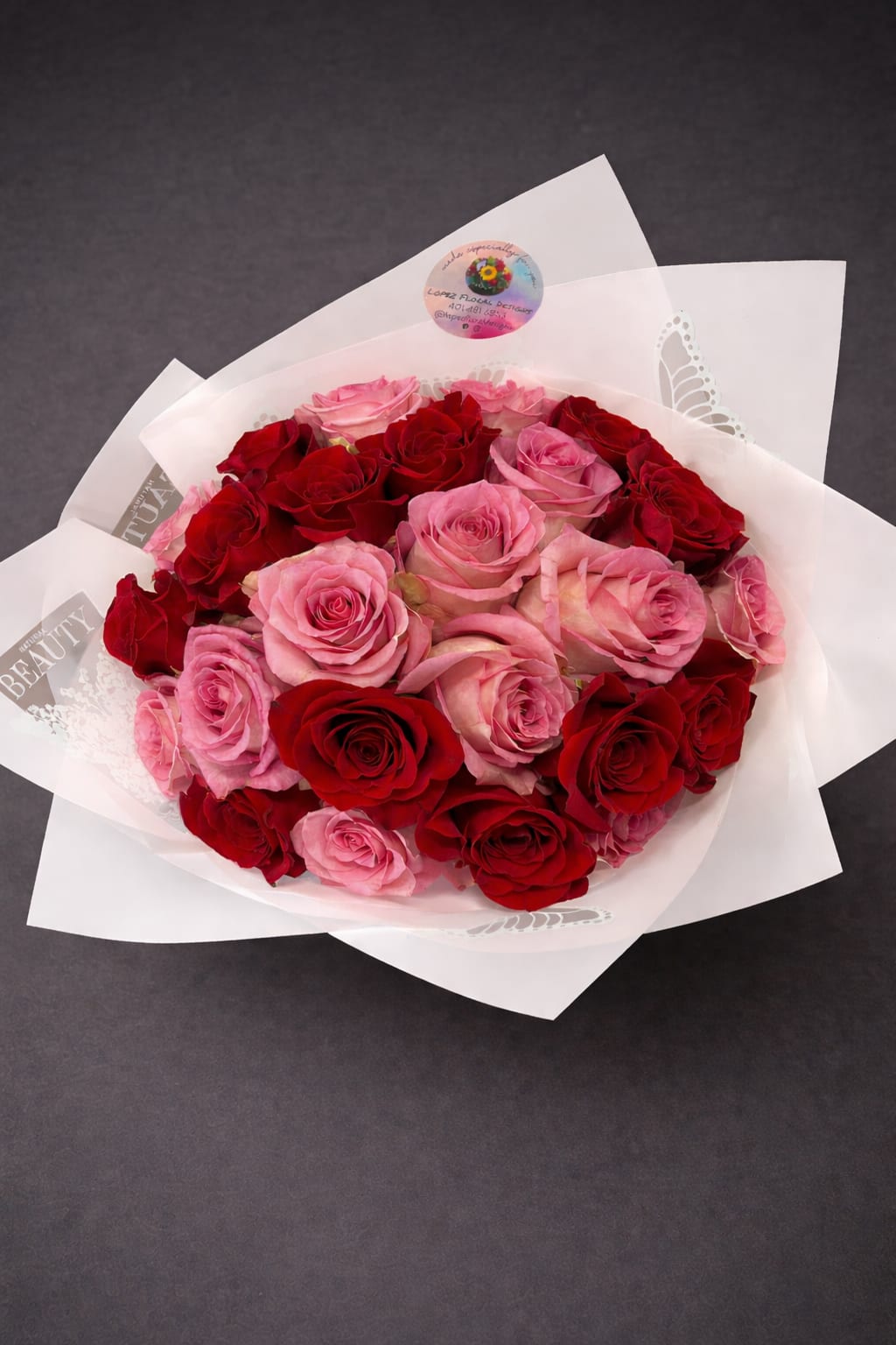 Two-Tone Romance Bouquet - A captivating bouquet showcasing rich crimson and delicate pink blooms. This eye-catching color combination beautifully balances intensity with sweetness, making it a perfect gift for expressing deep affection, celebrating milestones, or sweeping someone special off their feet.
