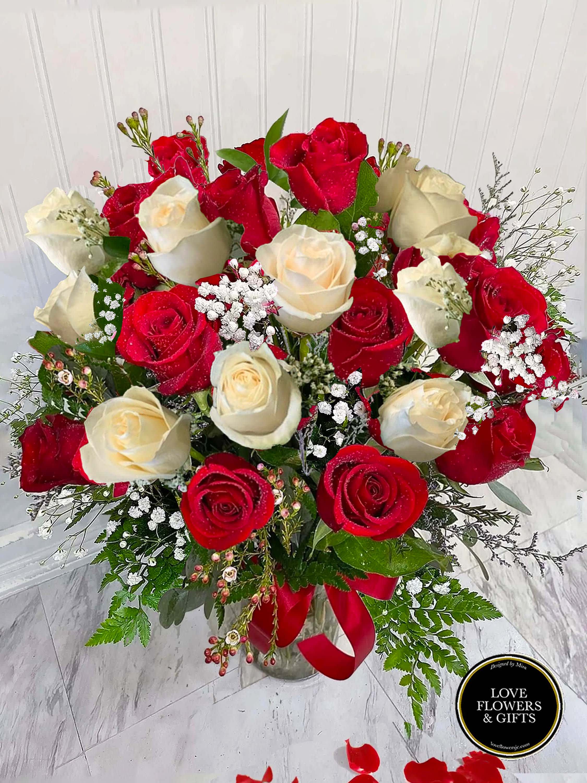 Fresh Red and White Roses - A classic and beautiful rose arrangement made of fresh red and white with filler flowers and greenery. Designed in a glass vase with a red ribbon. Roses are 50cm~   (Pictures Displays 24 Roses)   Would like to order more roses or a specific number of roses? Please call us!   