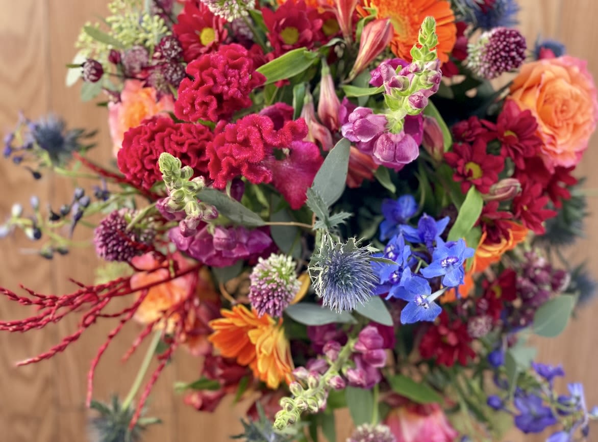JEWEL TONE HANDTIE - A definite WOW factor of gorgeous jewel tone flowers all wrapped up in a beautiful demonstration. This beautiful combination of colors will brighten up any room in the home or office….