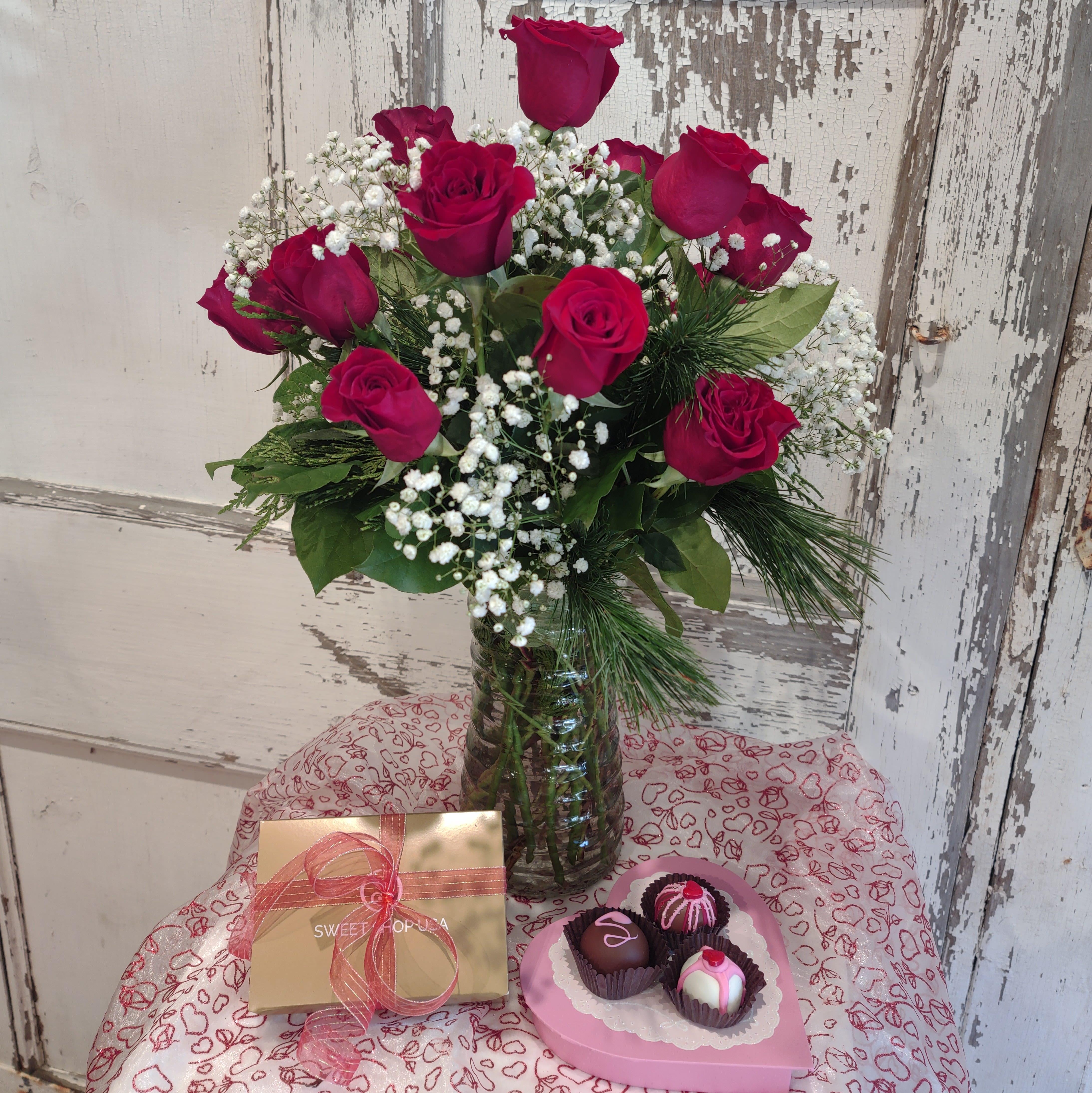 Forever My Sweetheart - A dozen red roses in a clear glass vase accompanied by 6 handmade truffles. 