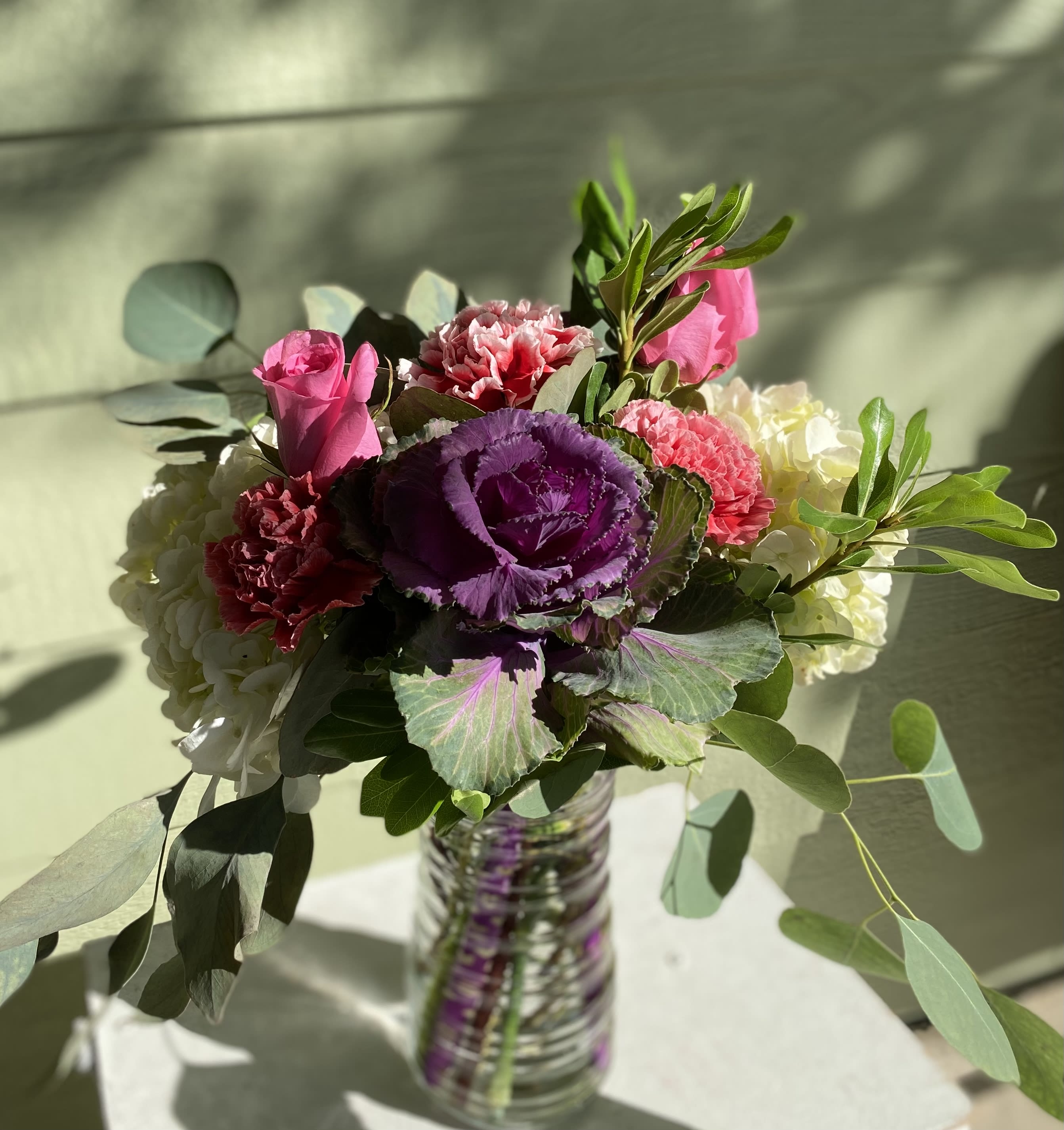 Colossal Kale Bouquet - This flow he upscale design showcases giant blooms of kale and hydrangea with pink accents and flowing greens. Surprise somebody you love today with this gorgeous selection of flowers!